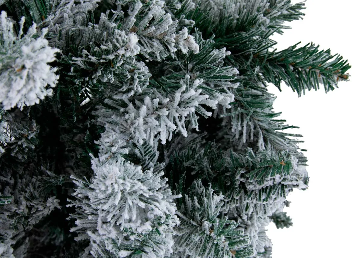 An 8ft artificial white Christmas tree from EZ Livings Noble range. Closeup of snow covered branches