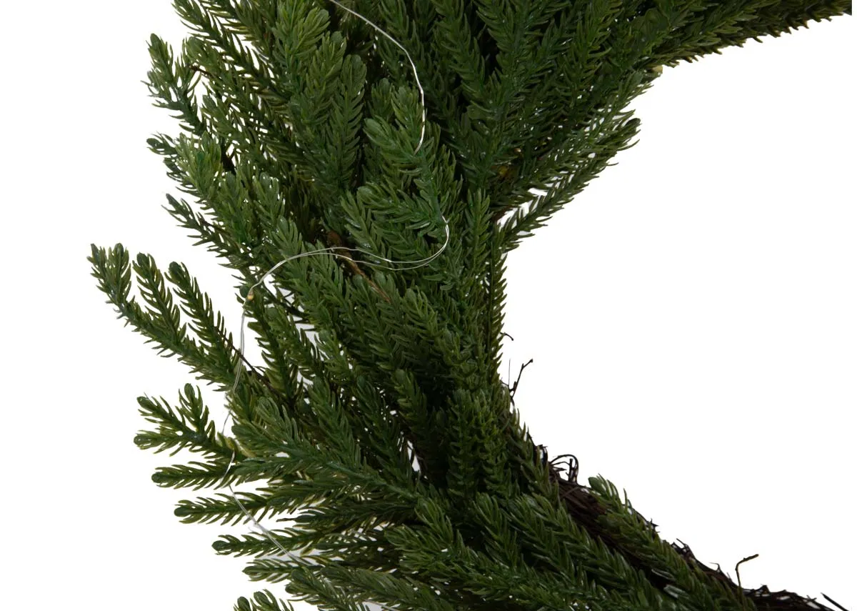 A green wreath with faux needle foligae from EZ Livings Christams range. Closeup of led lights