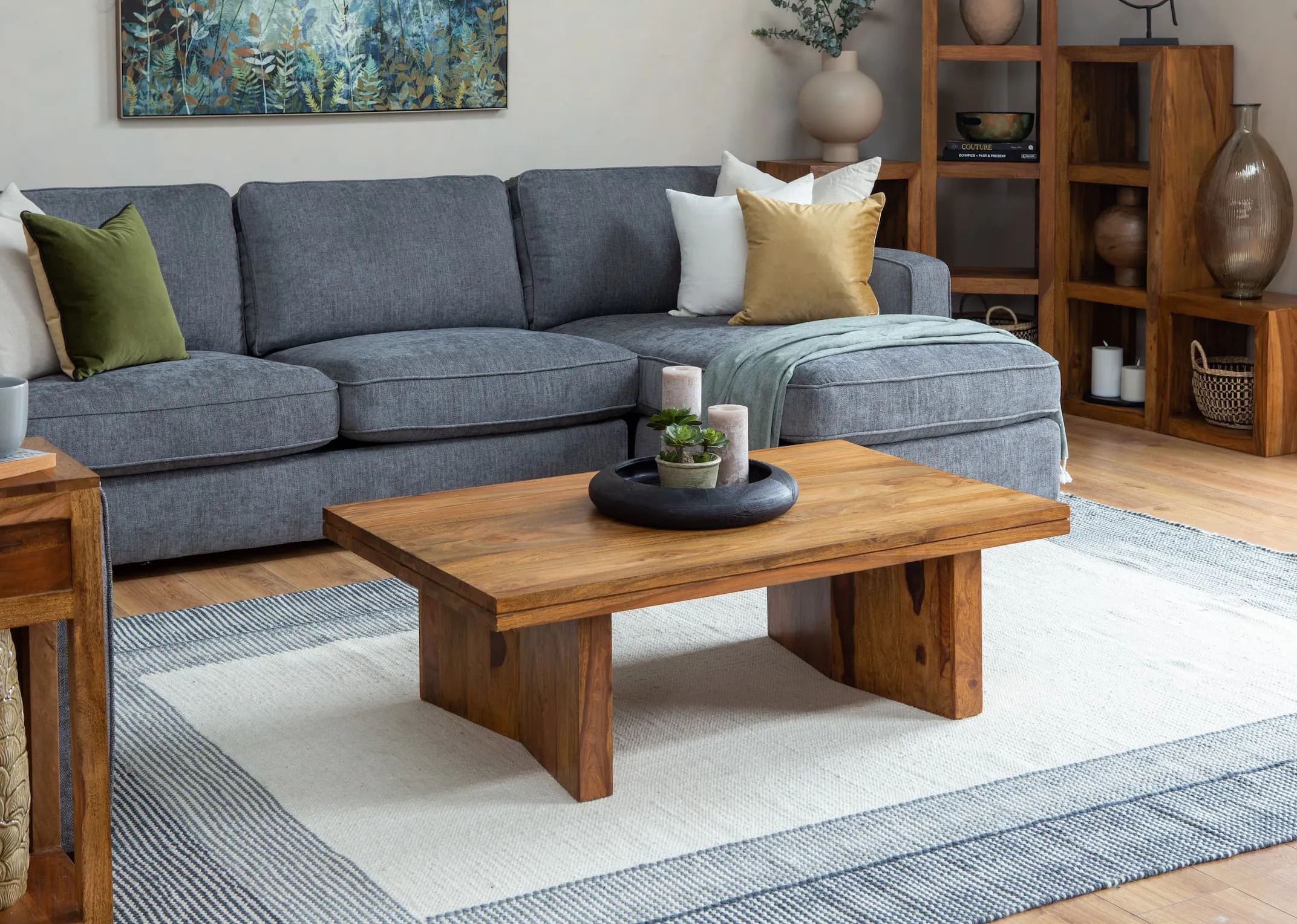 A lifestyle image of the Darwin Chaise with India coffee table & cubes dressed with vases