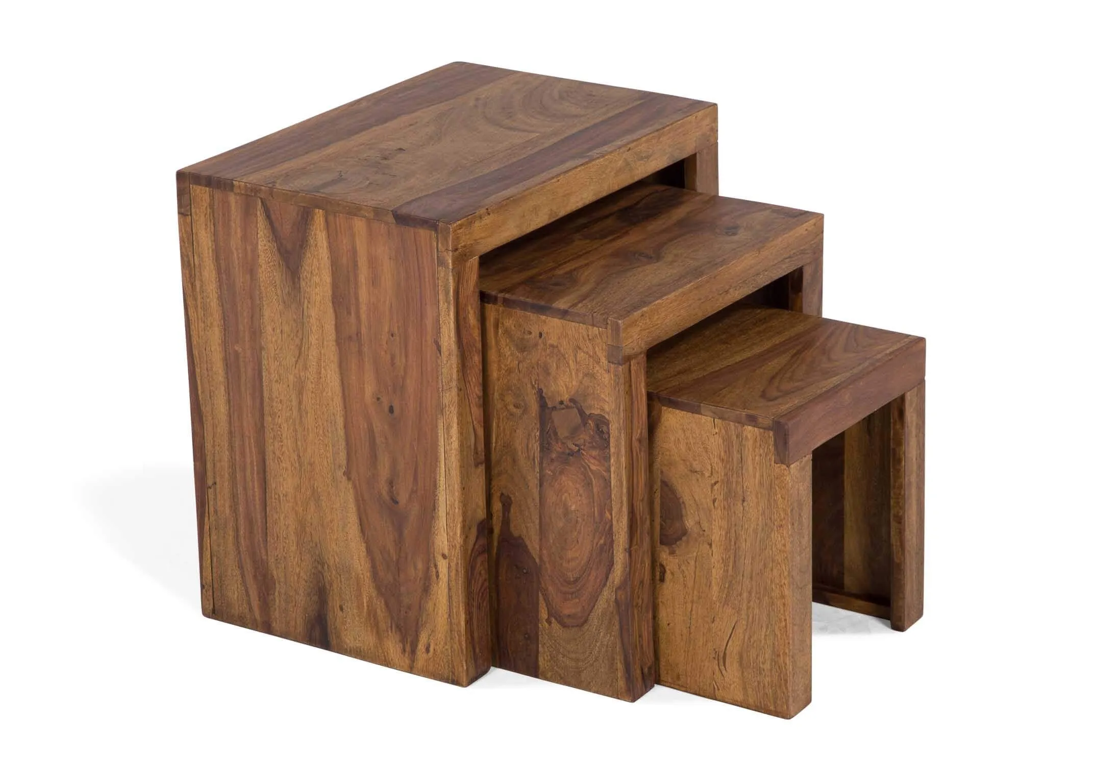 View of front and side of sheesham wood nest of three tables India