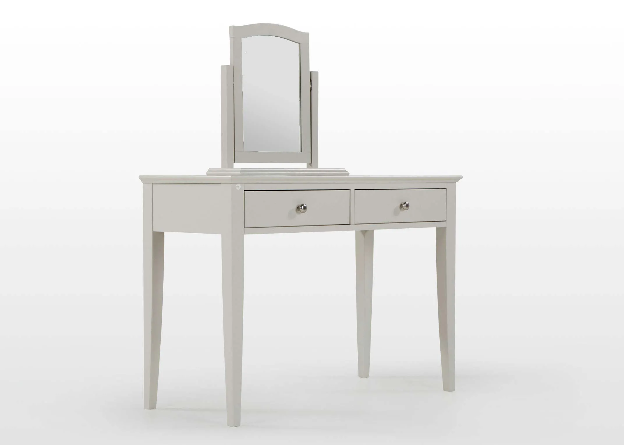 Angled shot of the Rivendale grey mirror sitting on top of an accompanying two drawer grey dresser