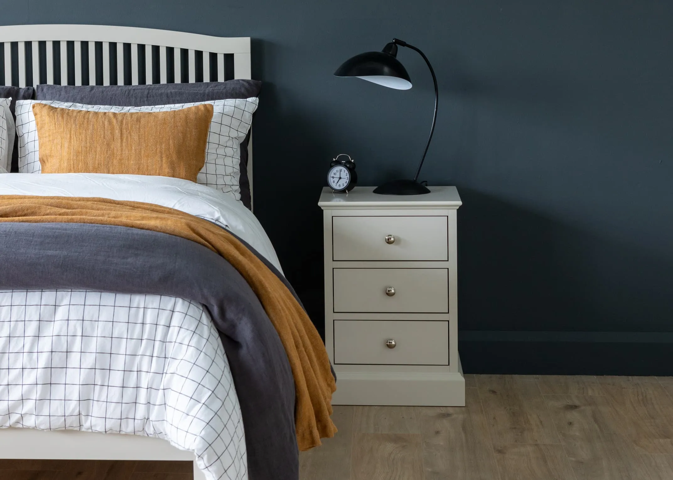 A lifestyle image of the grey 5ft rivendale bed with Chest & locker from EZ Living Furniture.