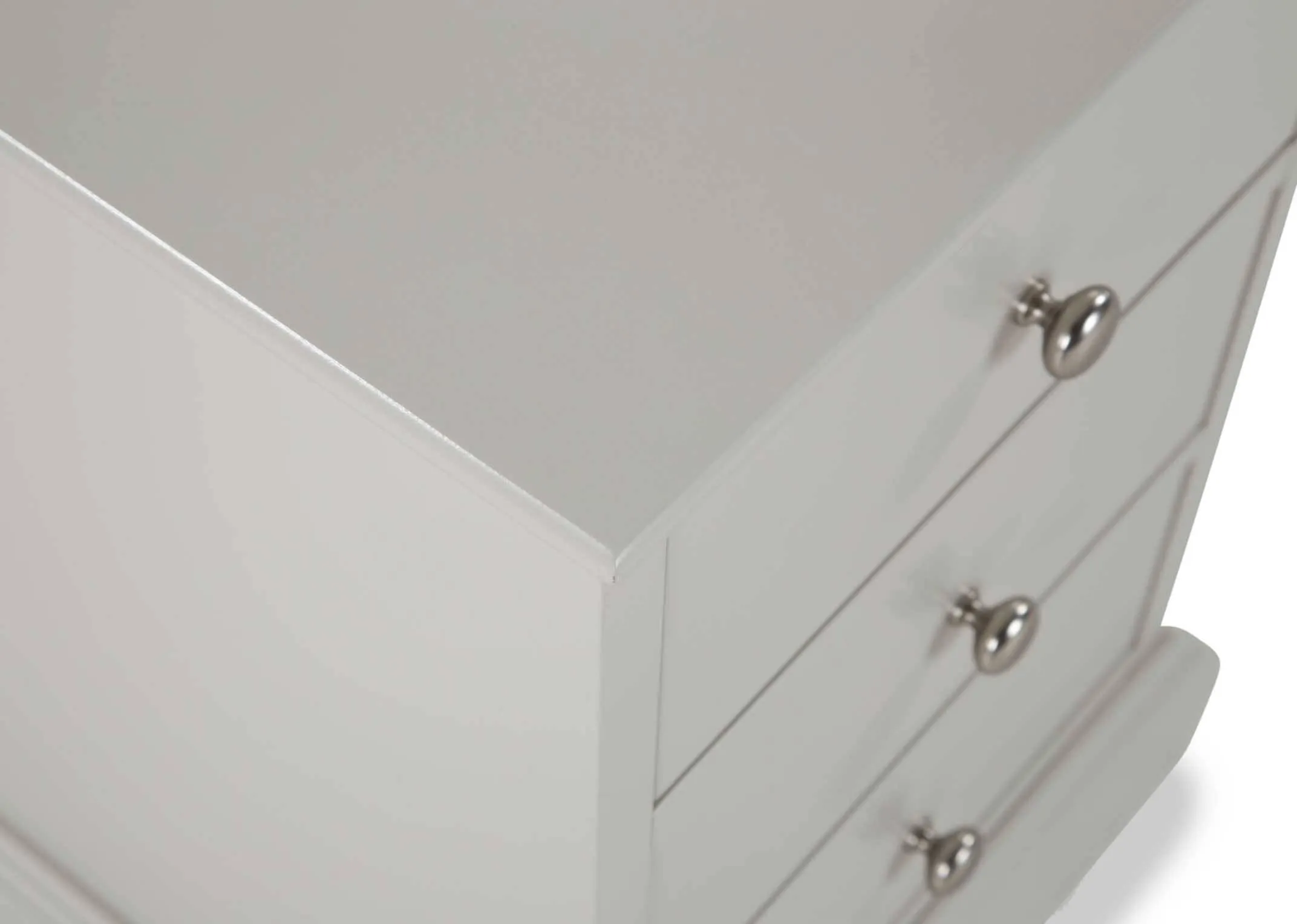 Detailed close-up of the Rivendale three drawer grey bedside locker showing the top of the locker and the three metal handles
