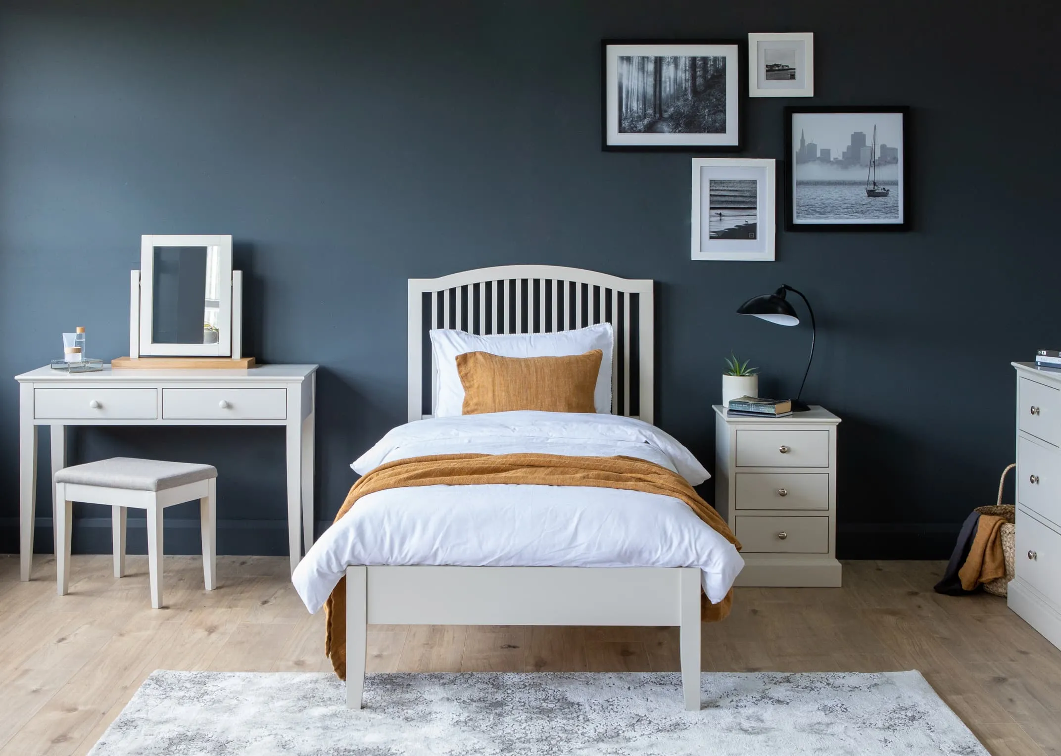 A lifestyle image of the grey rivendale bed with Chest & locker from EZ Living Furniture