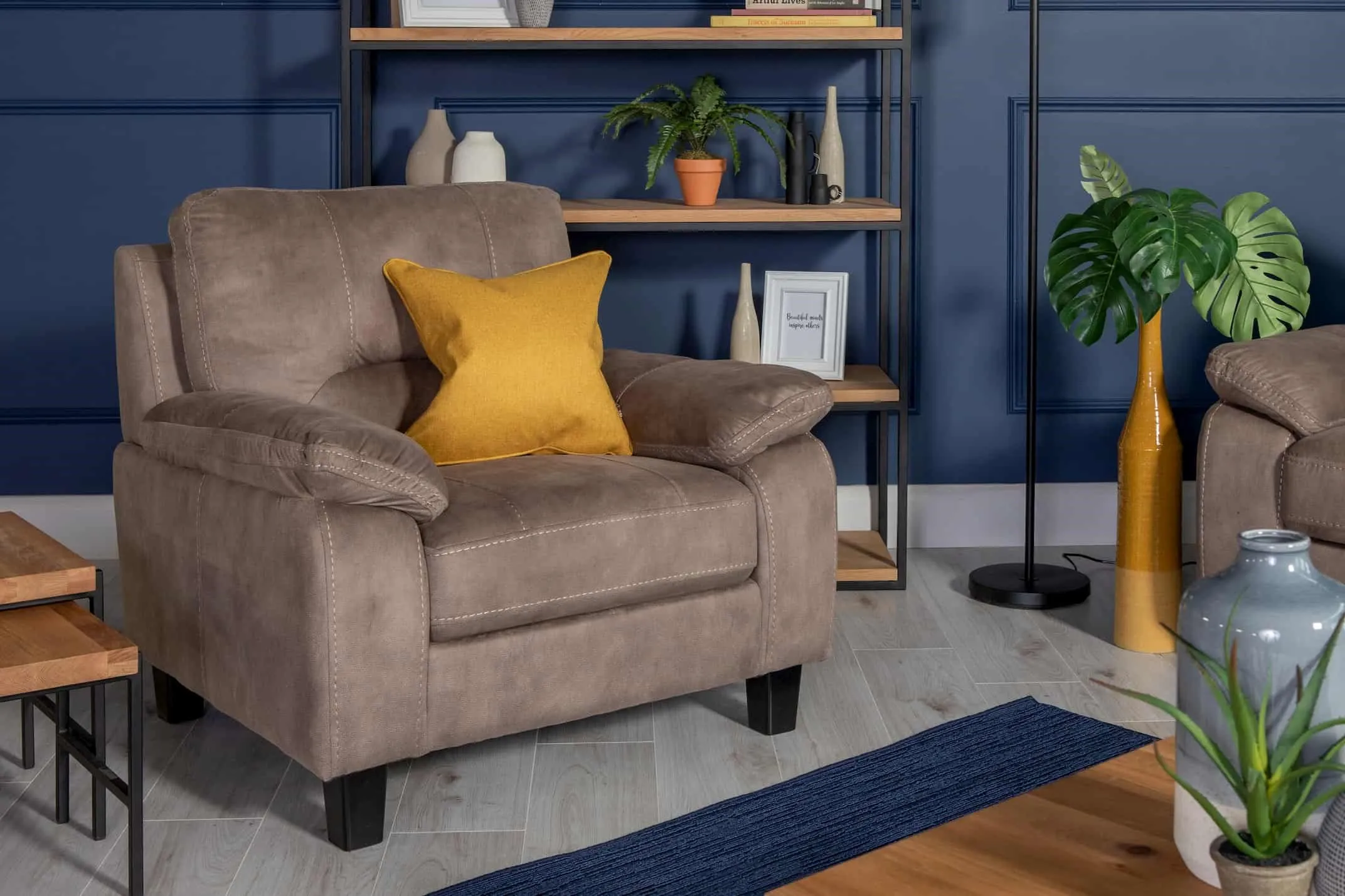 Lifestyle image of the Nikita Armchair in Taupe available at EZ Living Furniture.