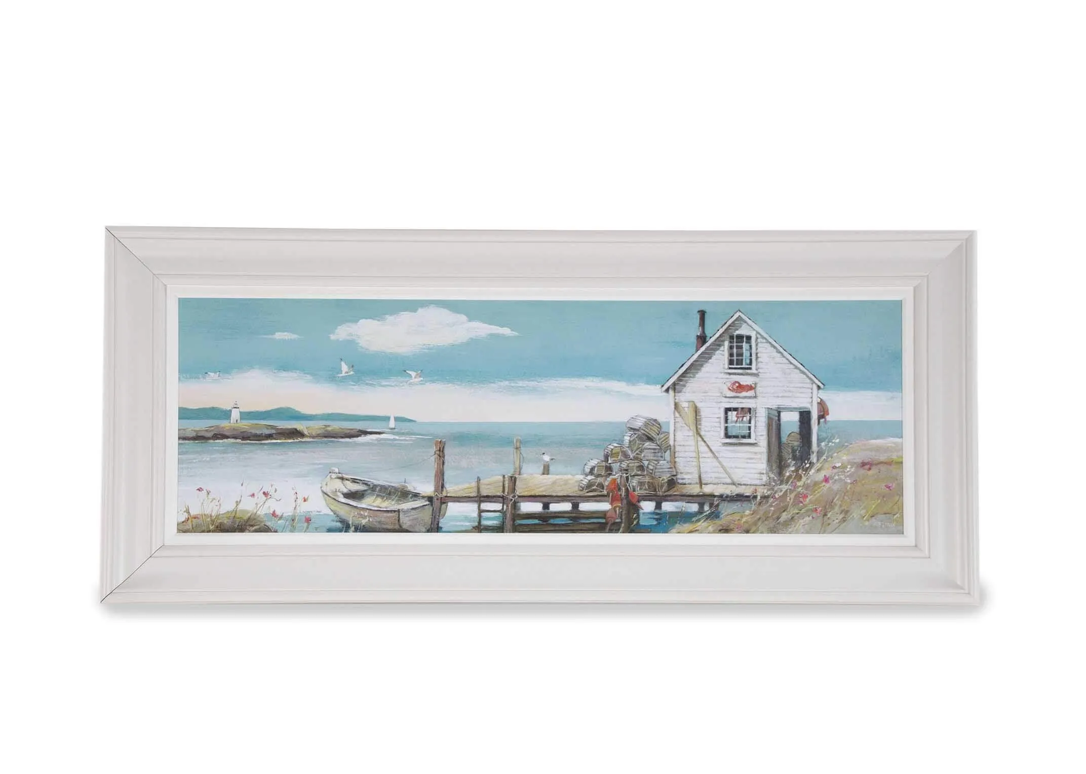 Full front view of the framed Adelene Fletcher print showing the image of a house by the sea with a white frame