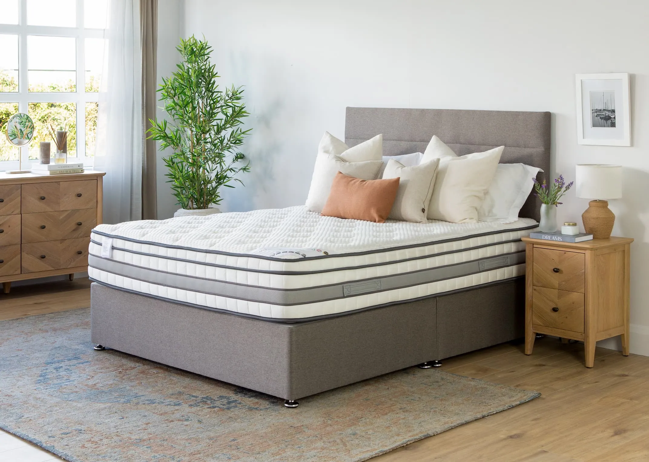A lifestyle image of the 5 feet king size white Cashmere mattress with Venice base & chevron locker and chest.