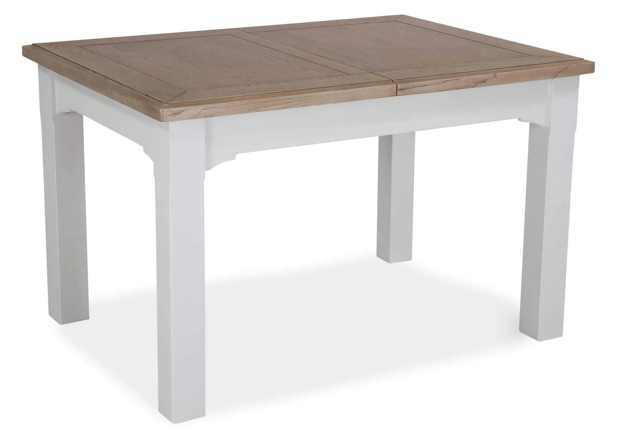 Angled view of the front of the dual coloured solid oak Georgia dining table