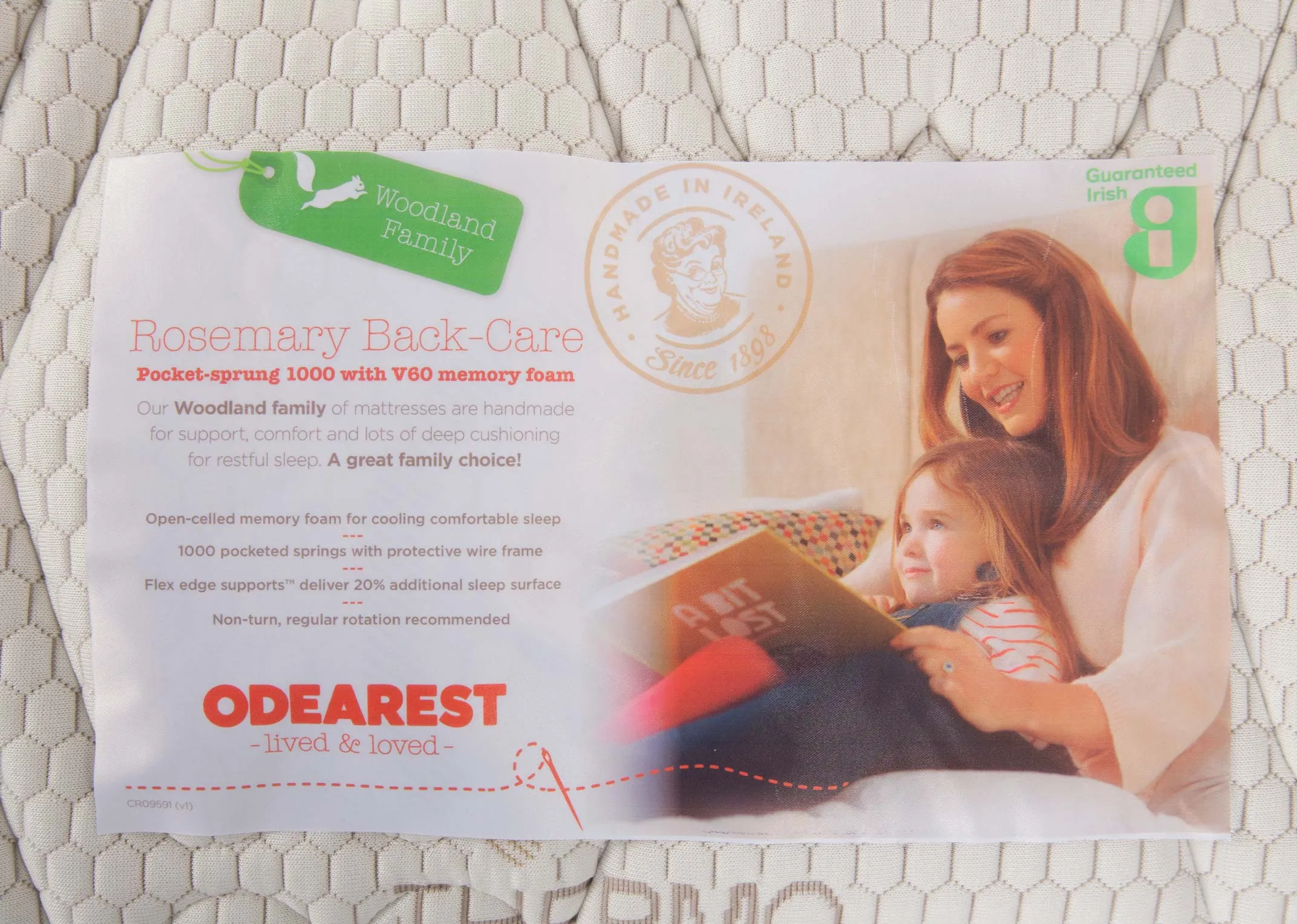 A 5ft pocket spring white mattress from EZ Living's Odearest range.Closeup of branding & benefits of back care mattress