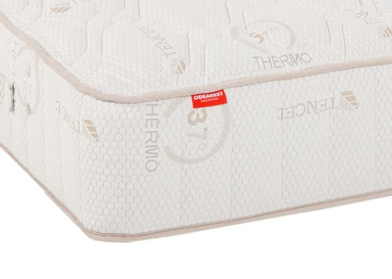 A 6ft pocket spring white mattress from EZ Living's Odearest range.Closeup of taupe trim