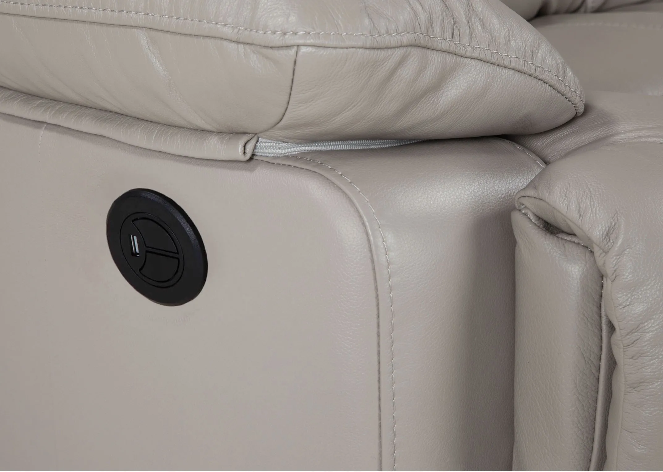A 2 Seater reclining sofa in soft grey leather from EZ Living Furnitures Groove range. Closeup button.