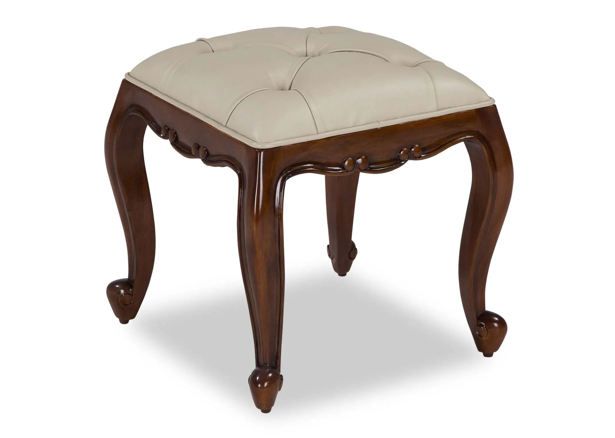 Angled shot of the cream leather stool from the Lyon five drawer mahogany dresser set