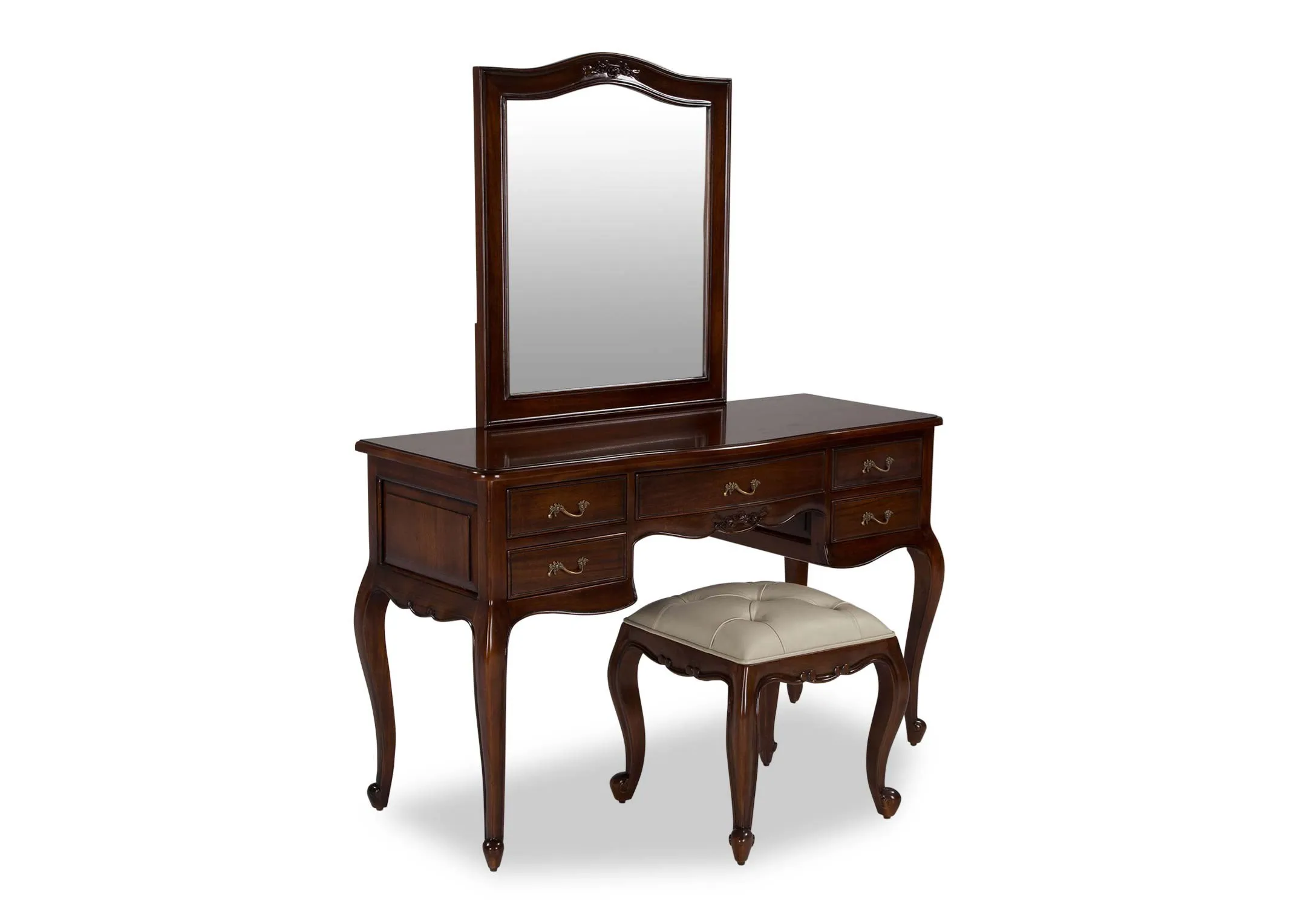 Angled shot of the Lyon five drawer mahogany dresser set with a cream leather stool and mahogany mirror