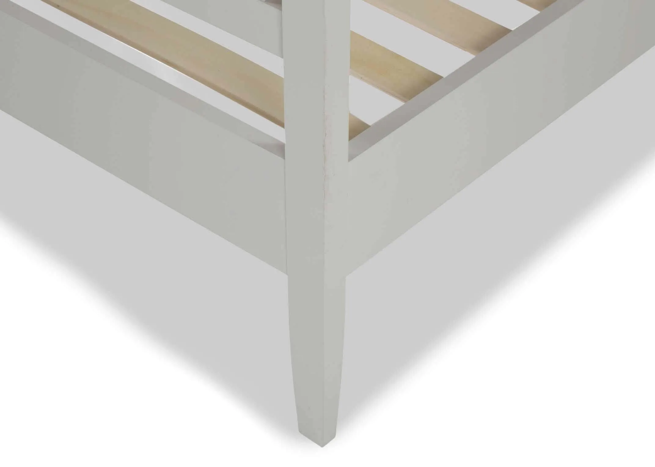 Detailed close-up view of the Rivendale double 4 ft grey bedframe showing the white wooden leg