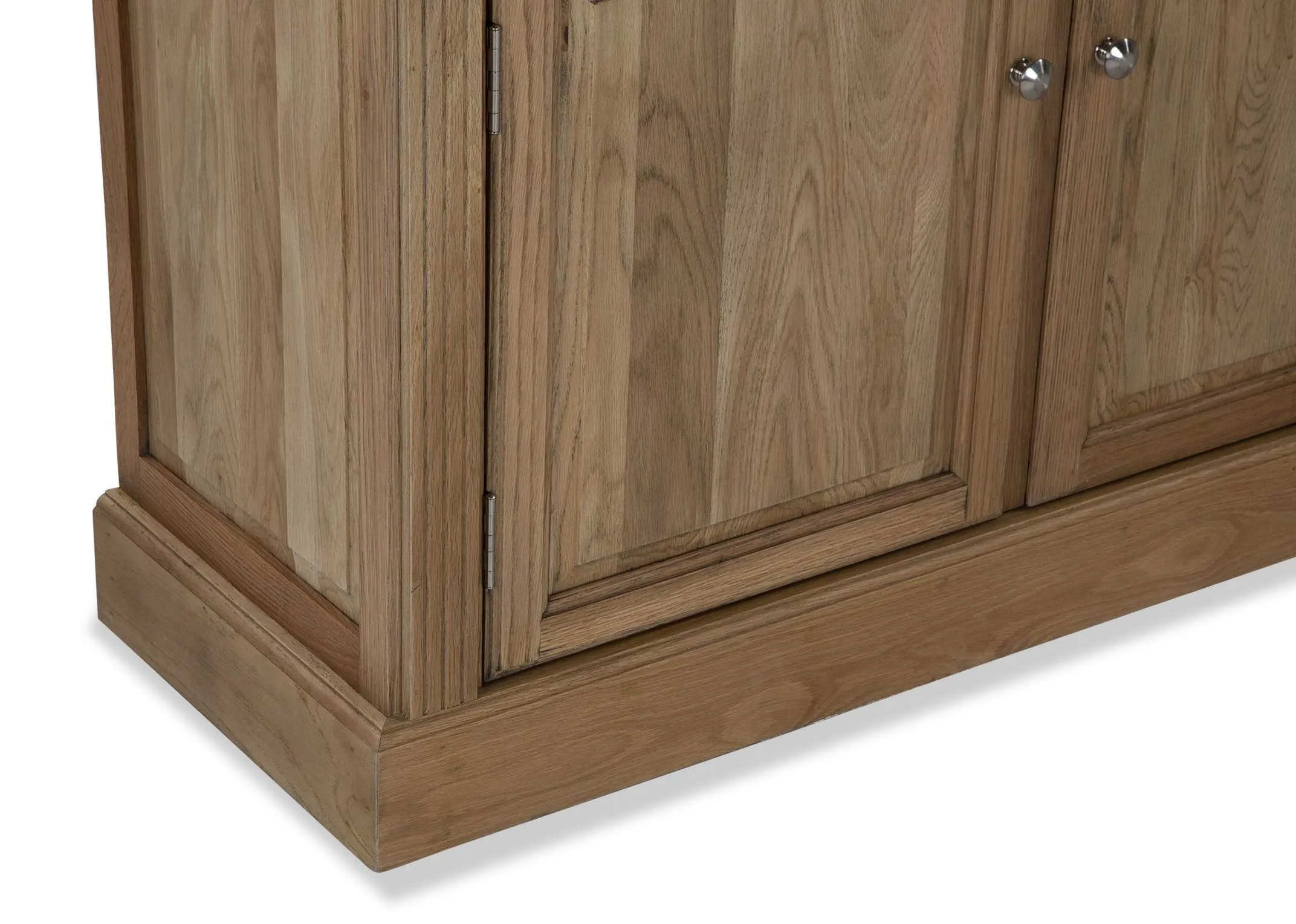A close up of the skirting on the Iona bookcase showing two doors with silver handles