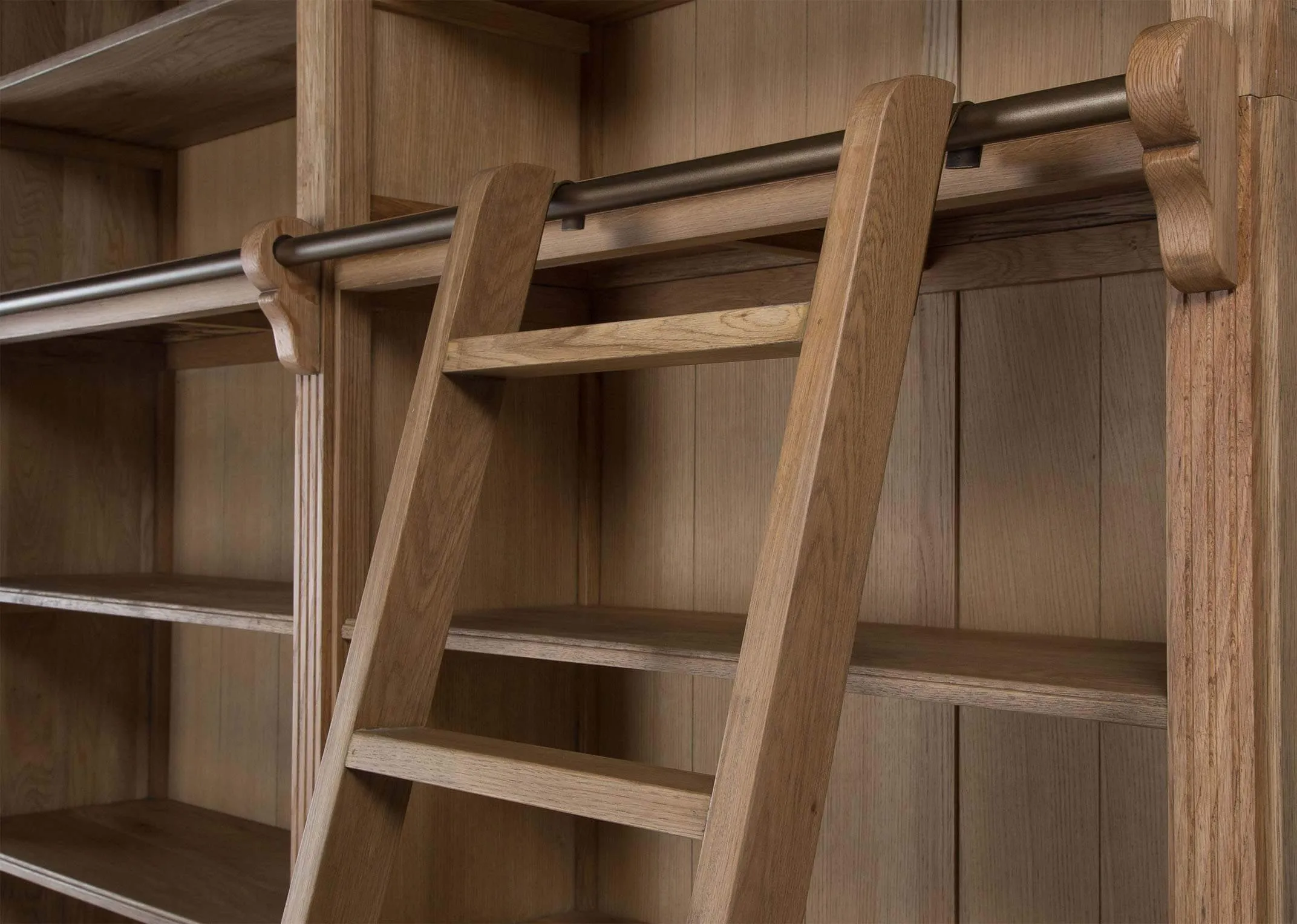 A close up view detailing the ladder and shelves on the Iona bookcase.