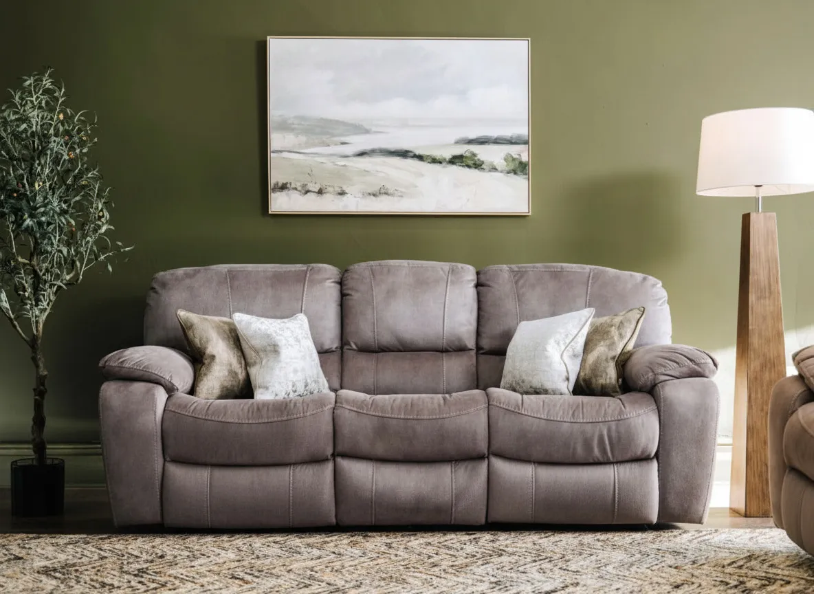 Detailed close-up view of the black reclining button from the Bradford 3 seater grey suede power reclining sofa