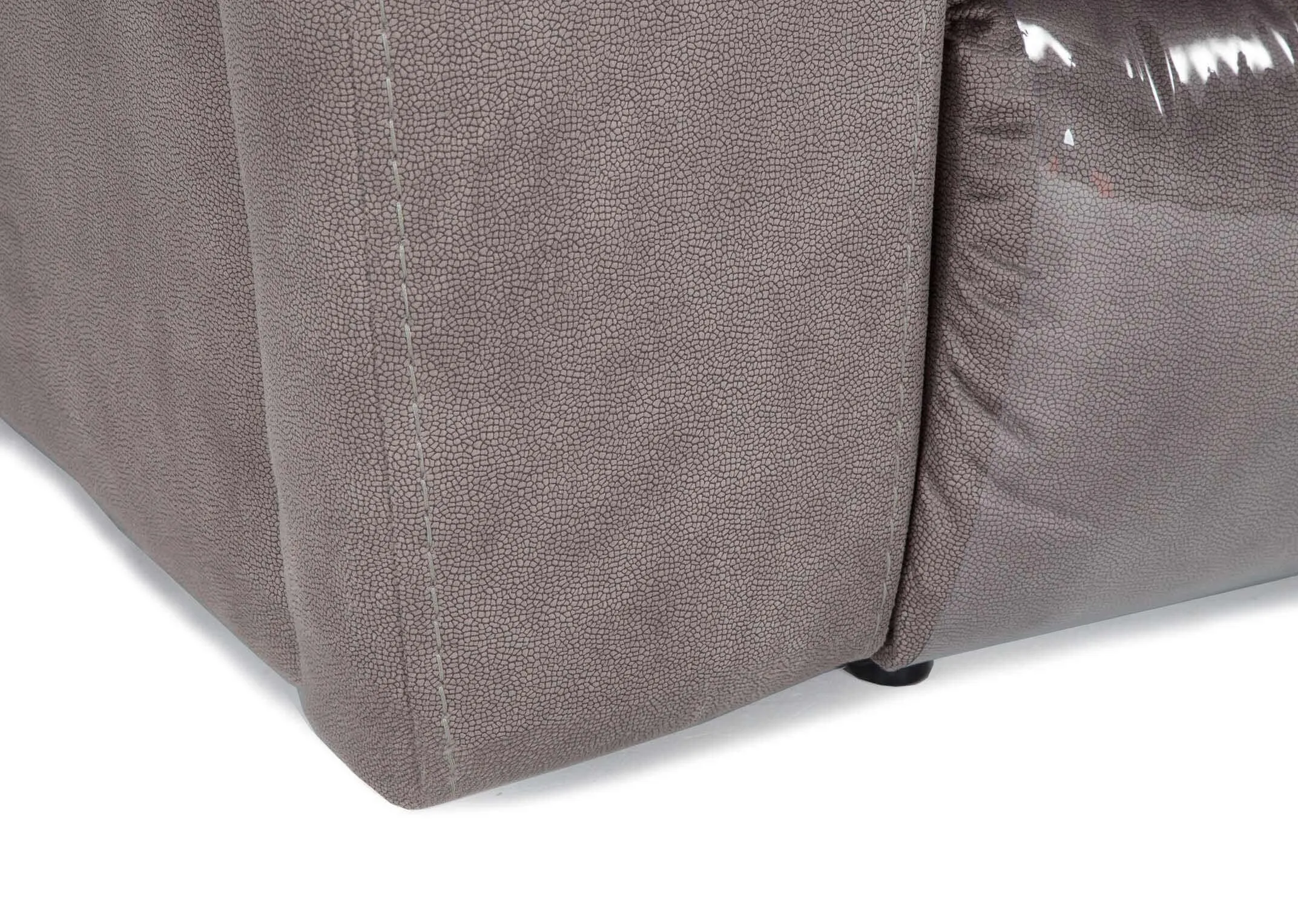 Detailed close-up view of the bottom corner of the Bradford 3 seater grey suede power reclining sofa