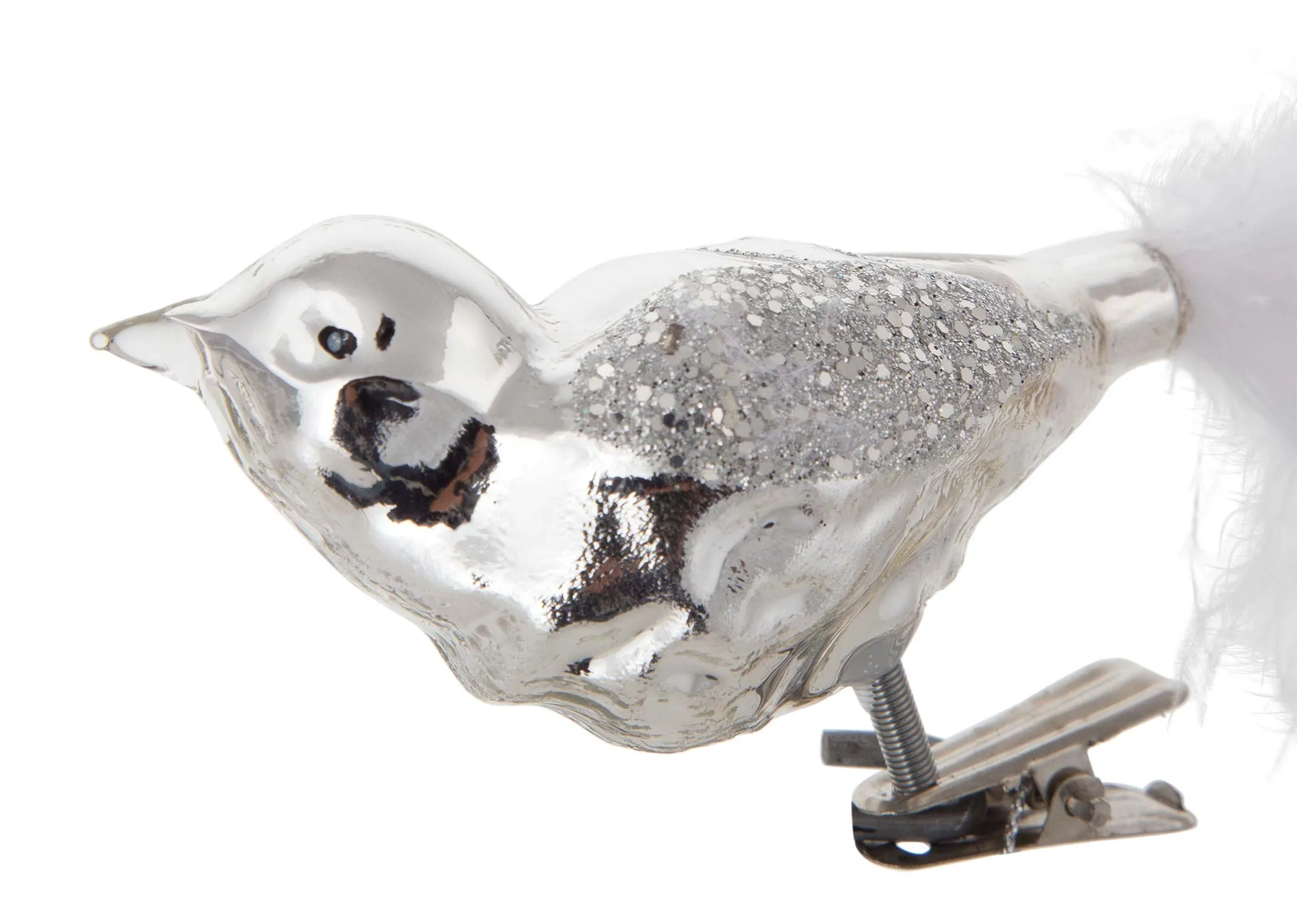 A close up of the head on the silver bird on a clip