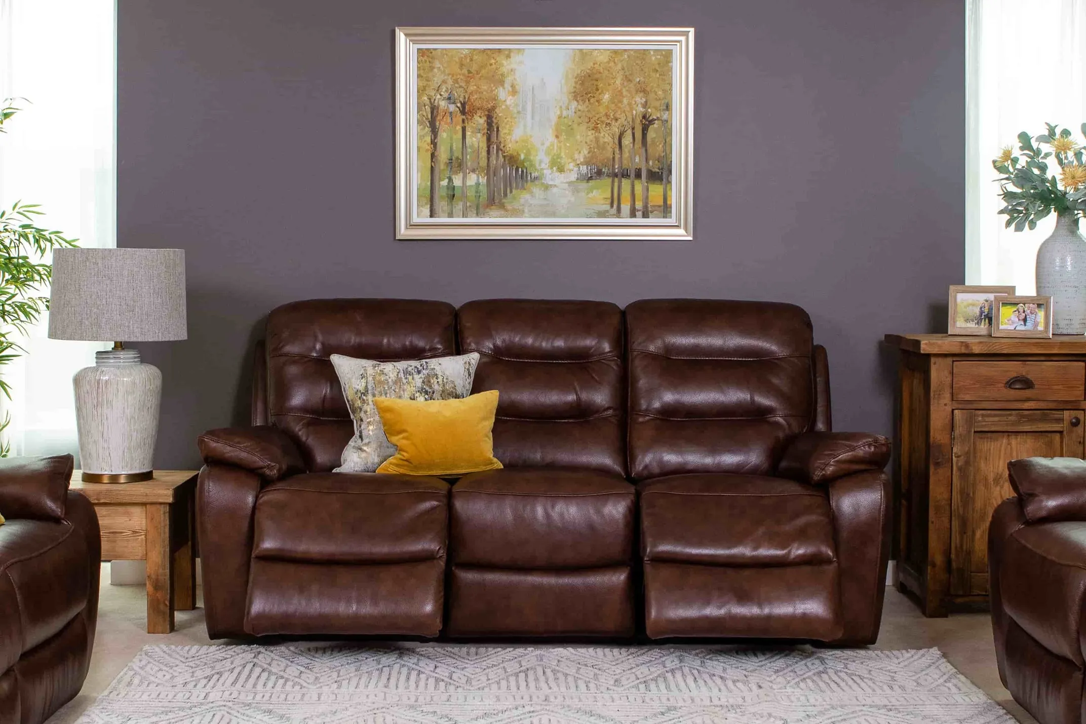 A lifestlye image of the Supreme power recliner in a semi-reclined position