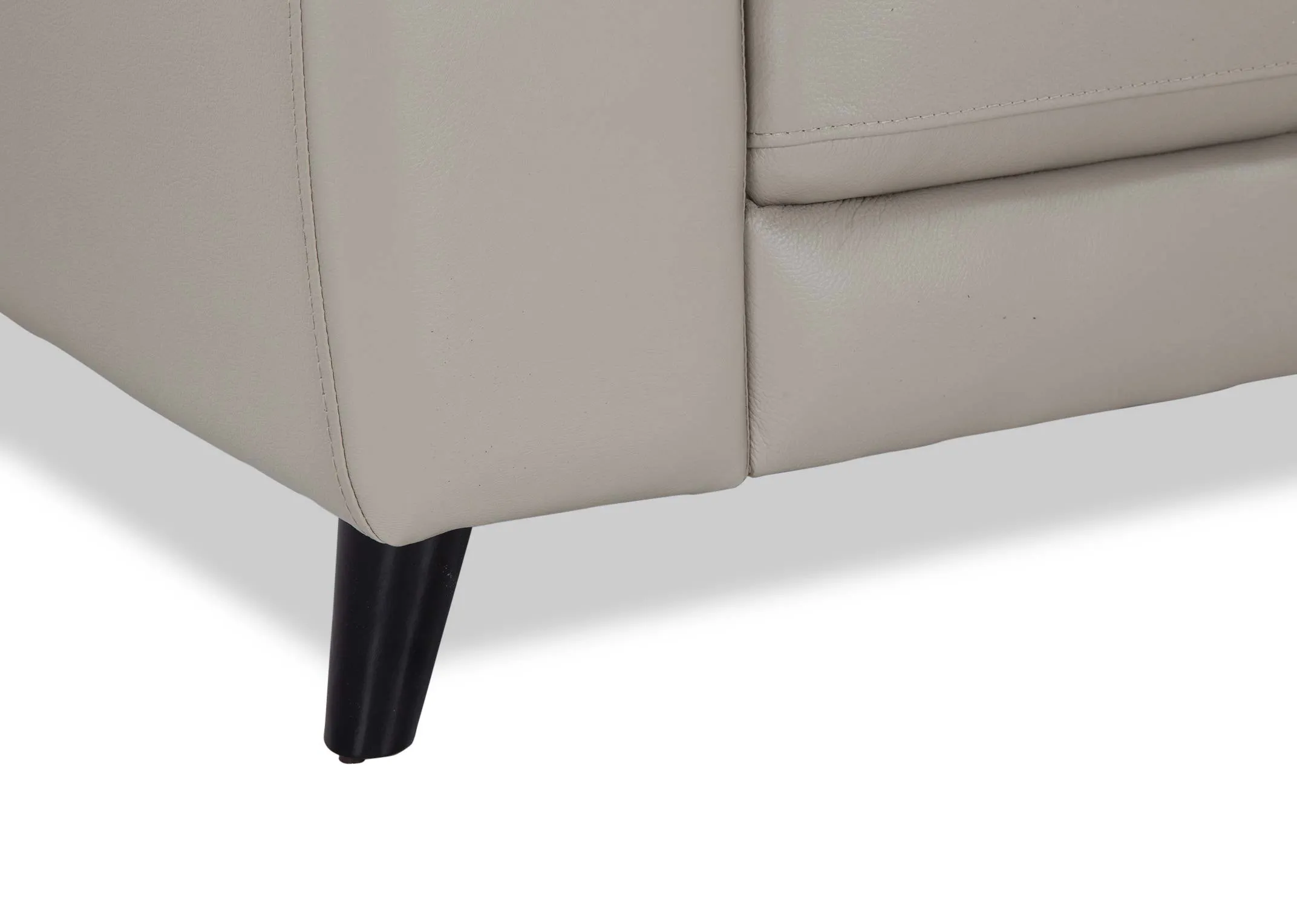 A close up of the dark coloured foot on the Alfredo 3 seater grey leather sofa.