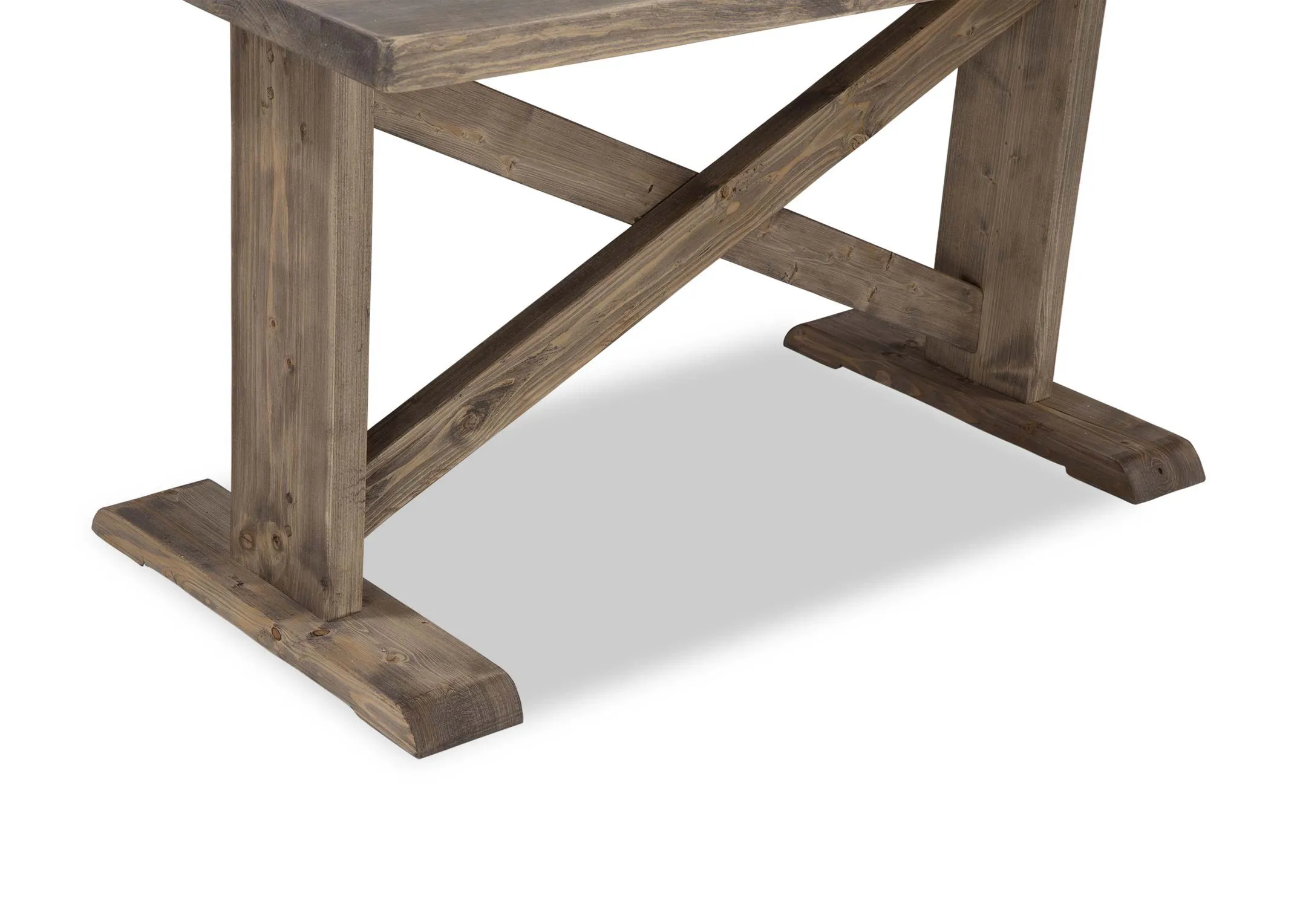 A close up of the rustic wooden legs with crossed detail on the Grafton wooden dining table.