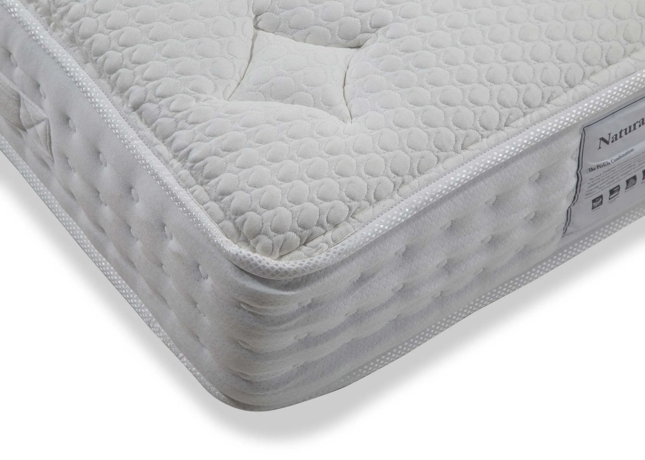 A close up of the corner of the 6 ft Natural Comfort super king mattress highlighting the micro quilted fabric.