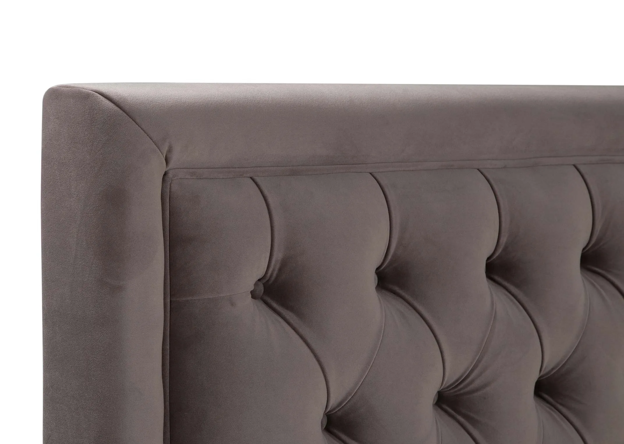 A close up image of the headboard corner of the Majestic 4ft 6 Grey Velvet Bedframe.