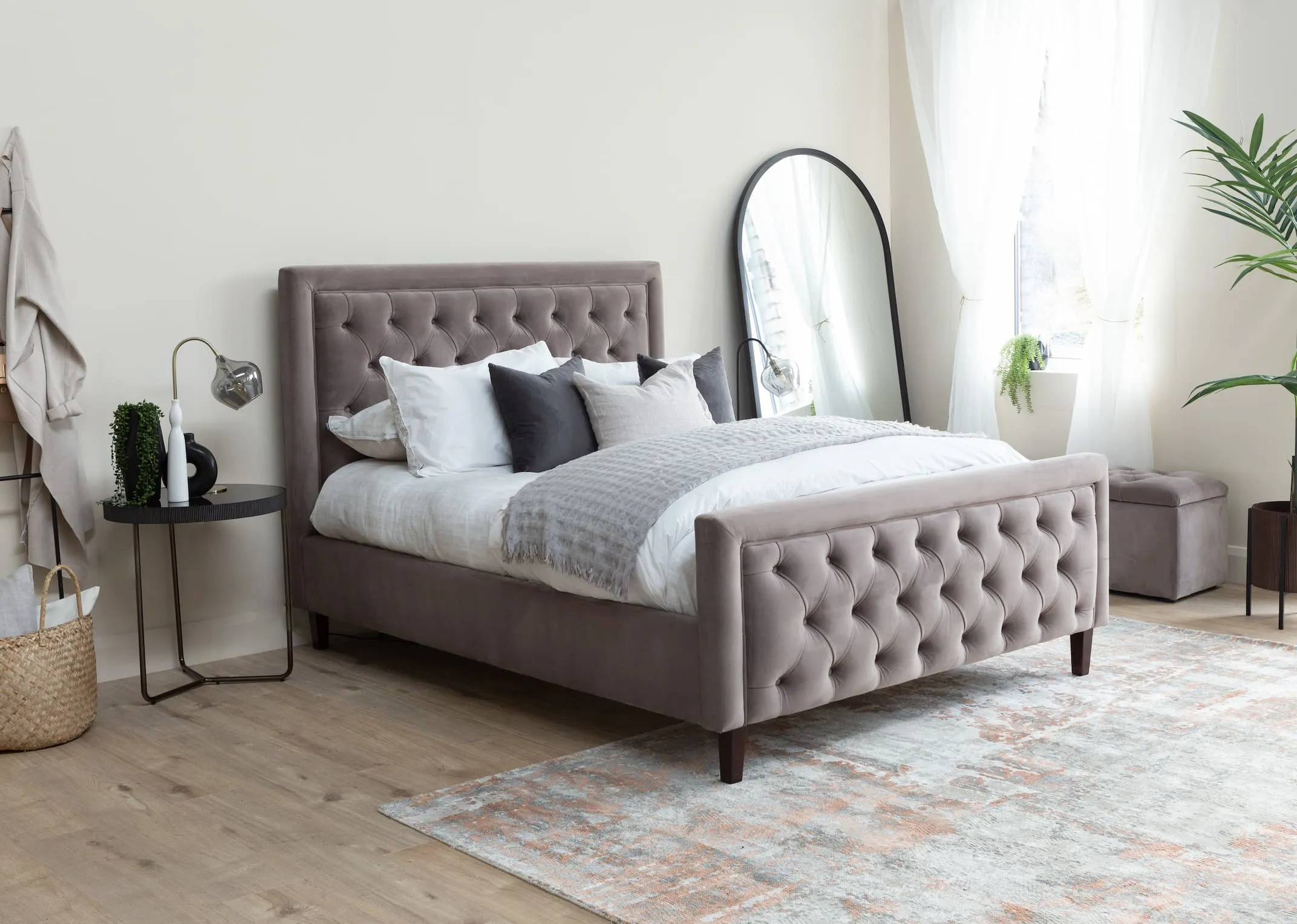 A taupe velvet Majestic bedframe with blanket box & the Mandy side table & Chrisley mirror.