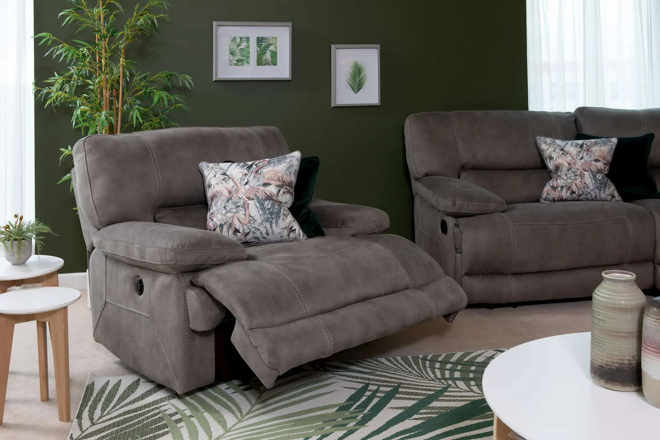 A lifestyle image for the Baxter Grey Armchair reclined with the rest of the range available at EZ Living Furniture.