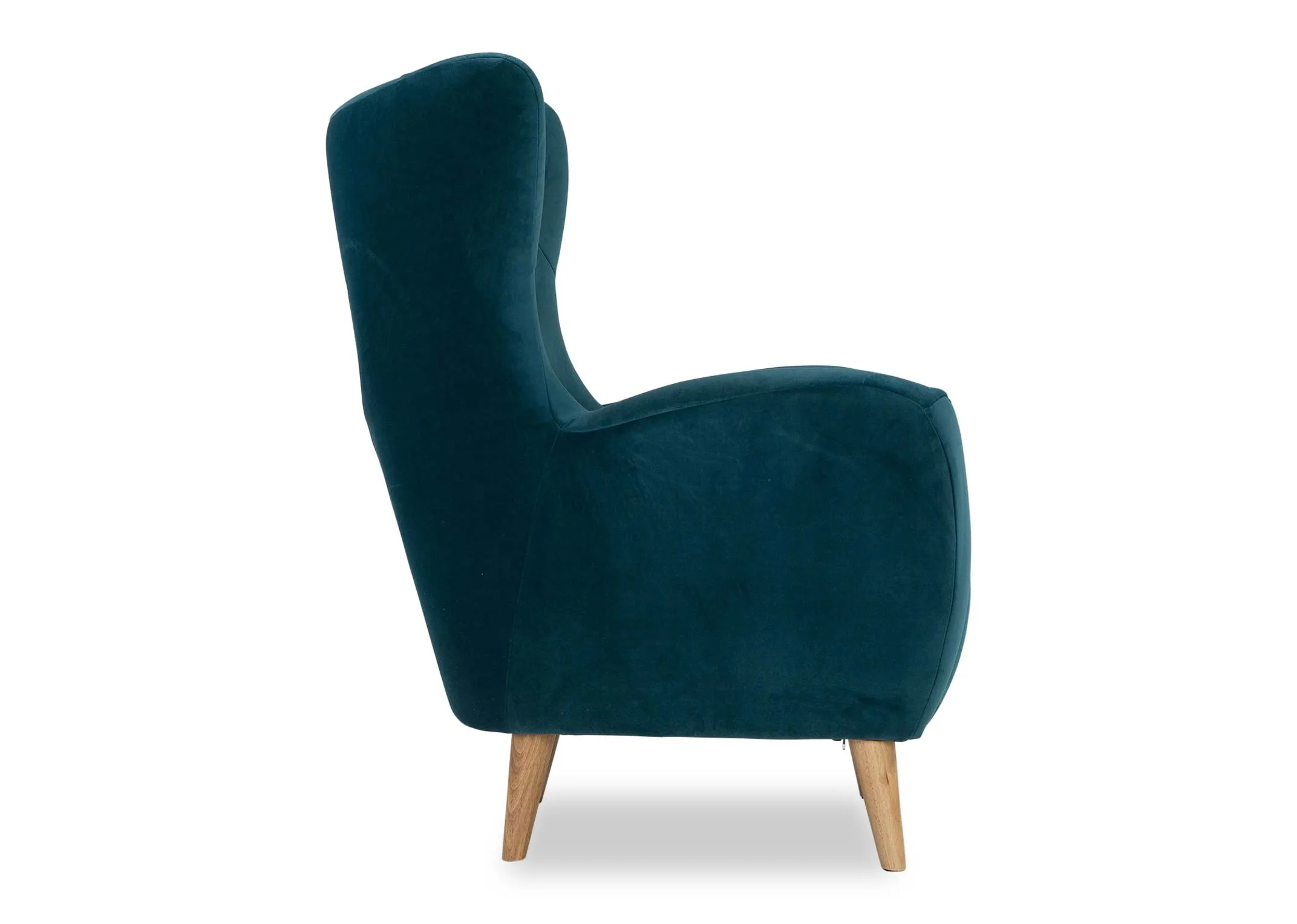 A view from the side of the Bronx armchair in teal velvet.
