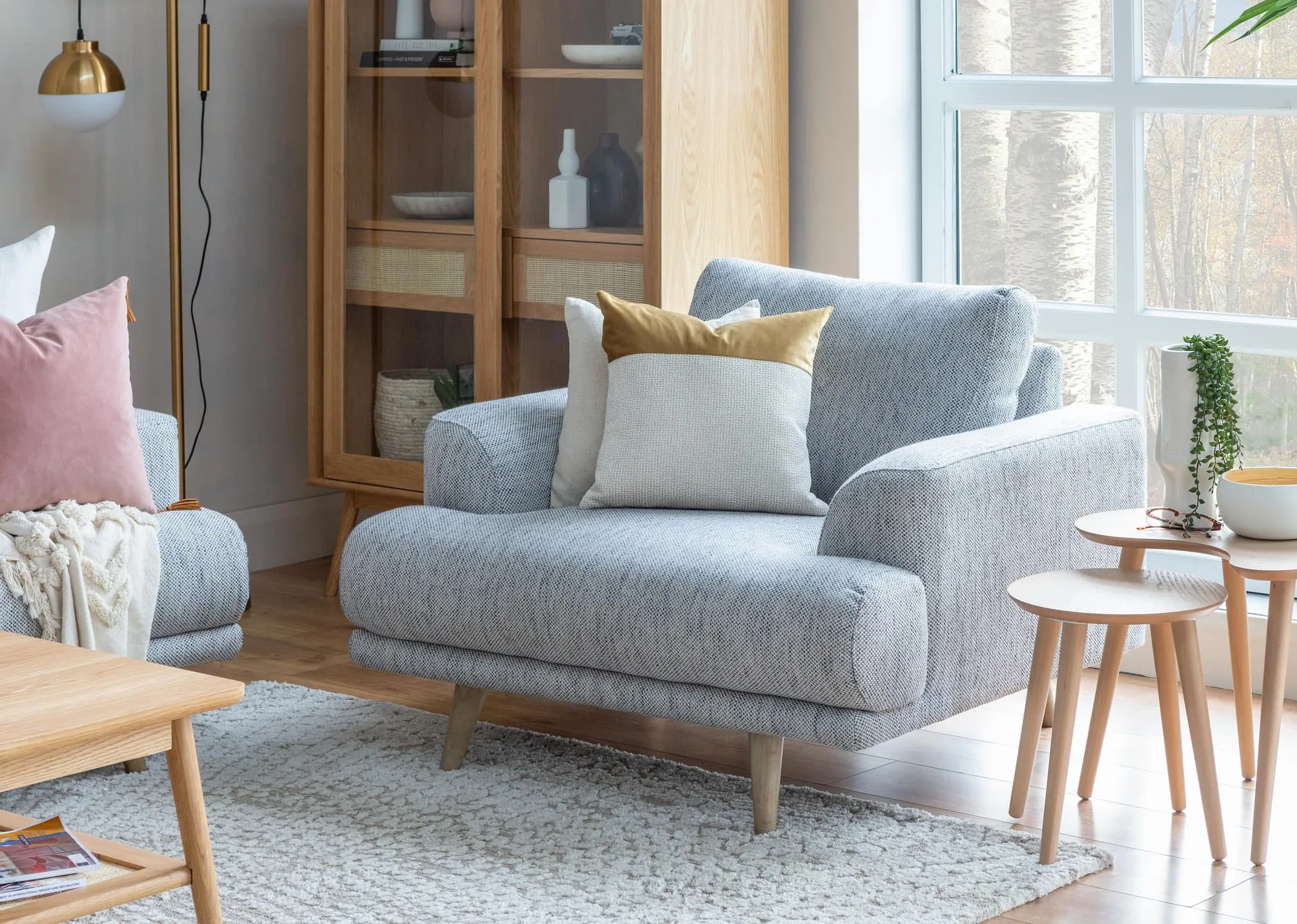 A lifestyle image of the Legend armchair with dansk nests