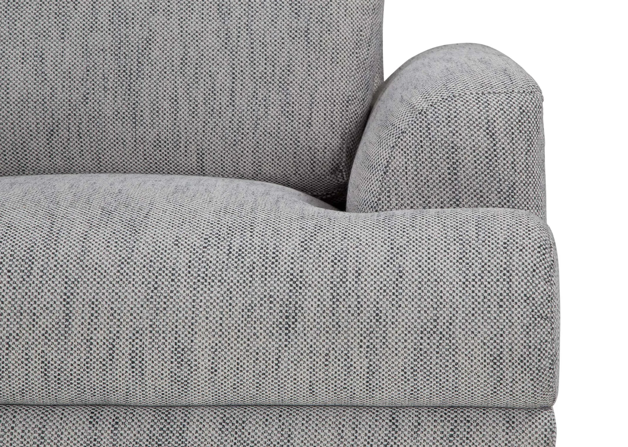 A cose up of the upholstery on the armrest of the Legend armchair in grey fabric.