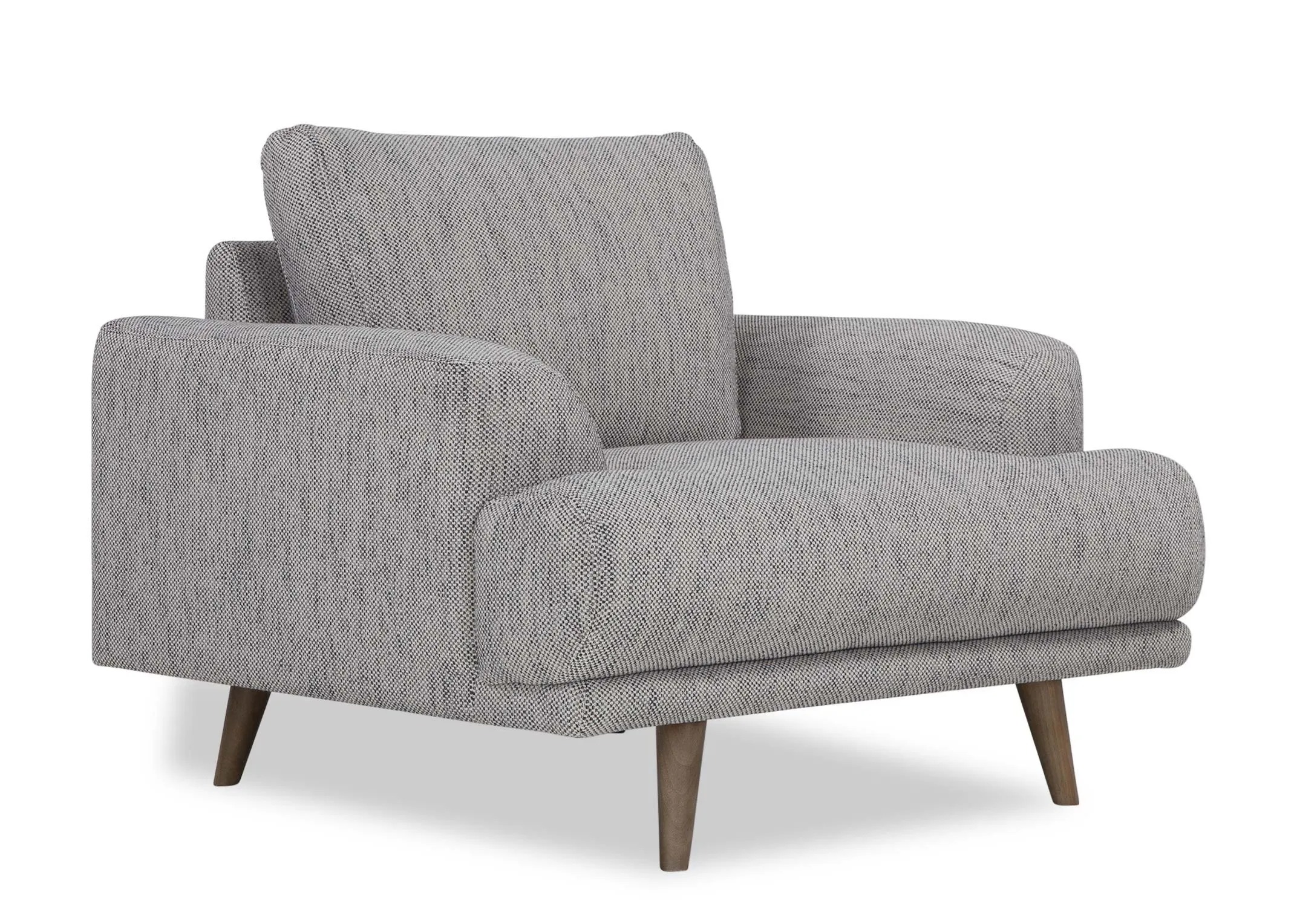 Anangled shot looking at the Legend armchair in grey fabric.