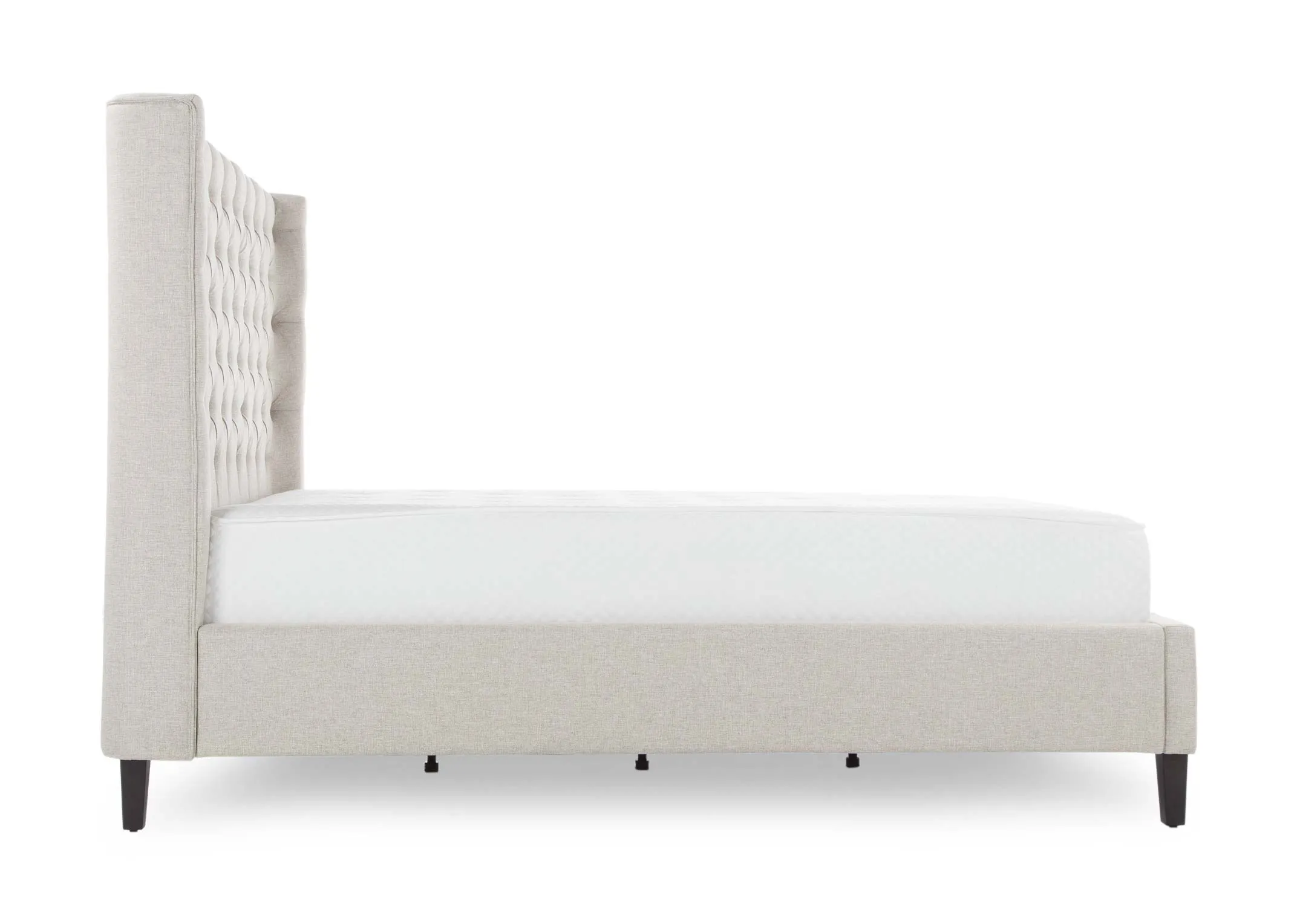 A view from the front looking at the beige fabric 6 ft Chelsea bedframe