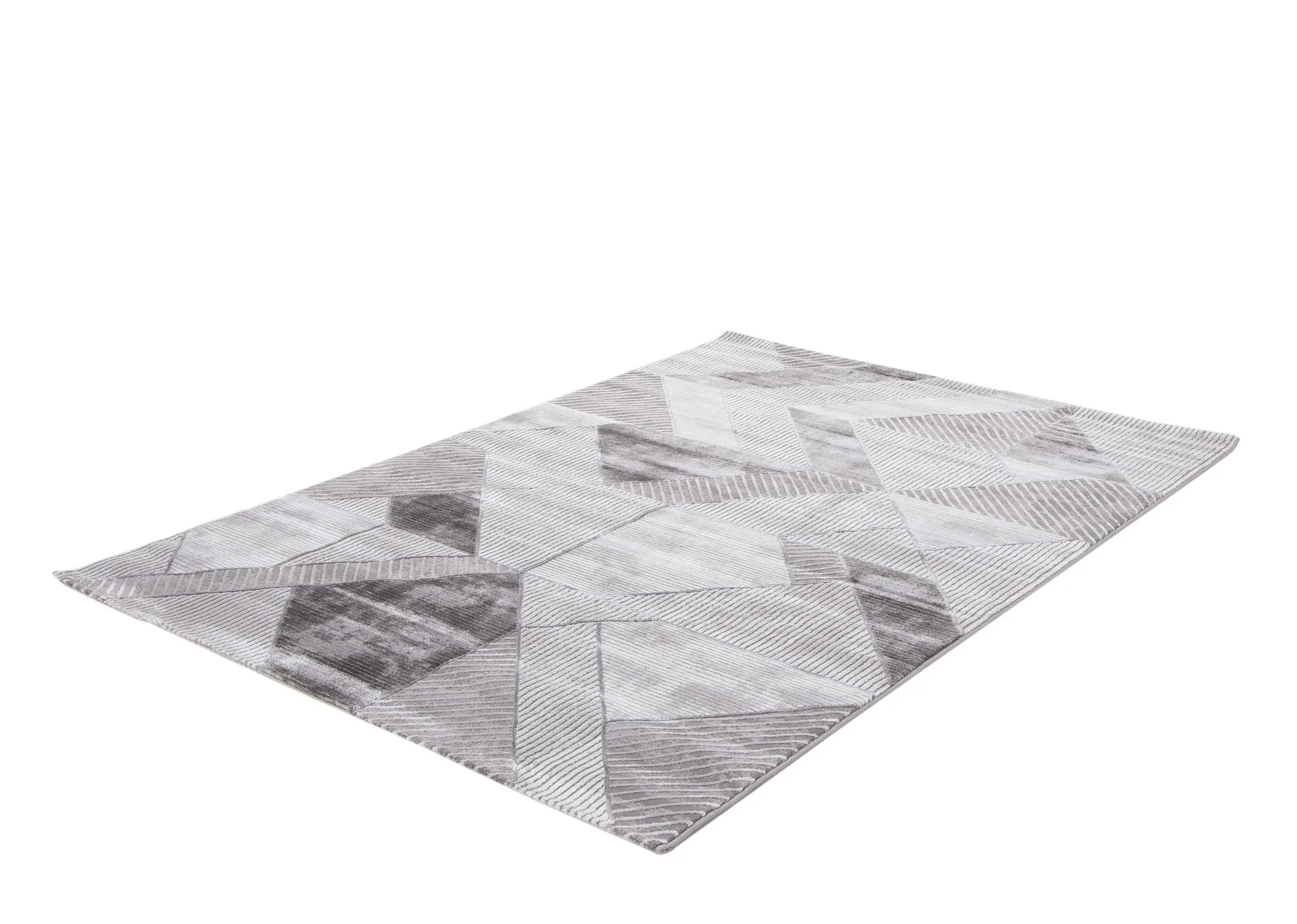 An angled view of the large geometric grey Dexter rug