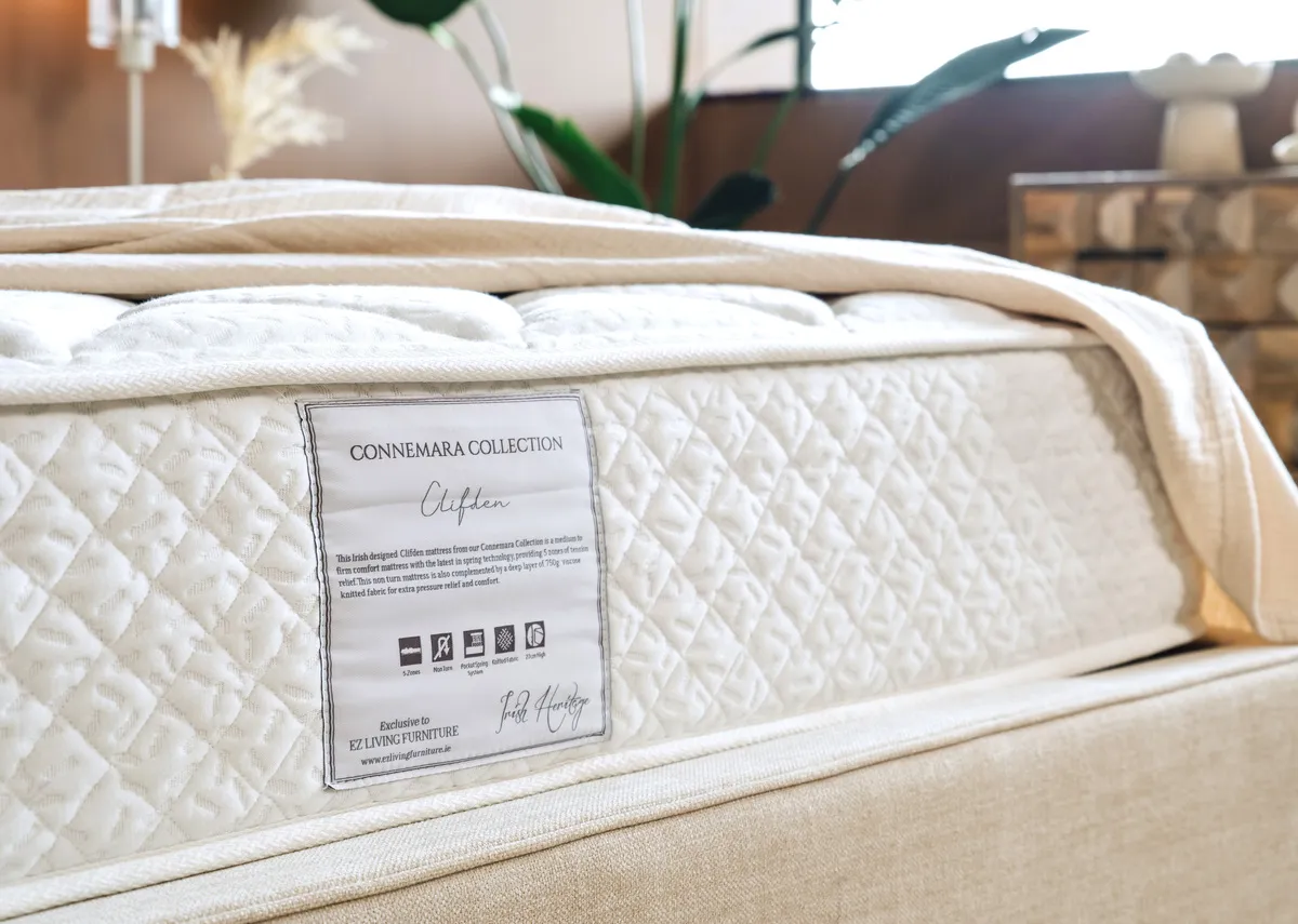 A lifestyle image of the Saoirse bed with a closeup on the Clifden mattress benefits.