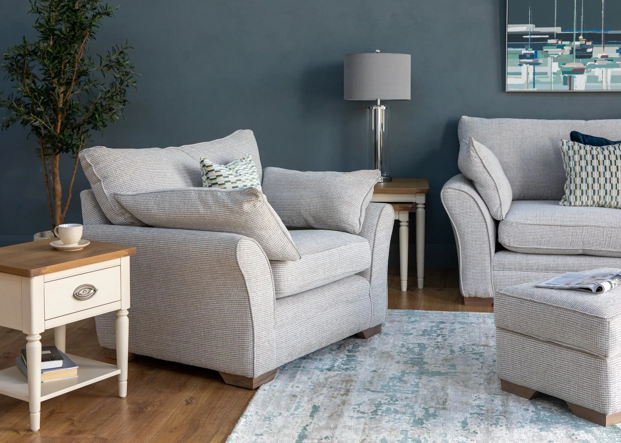 A lifestyle image of the Strata Armchair with Farmhouse lamp table & nests