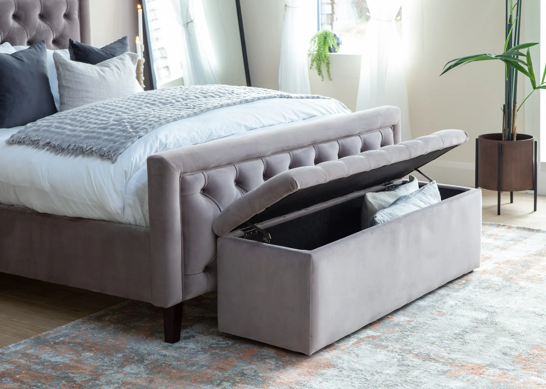 A taupe velvet Majestic bedframe with blanket box & the Mandy side table & toby planter