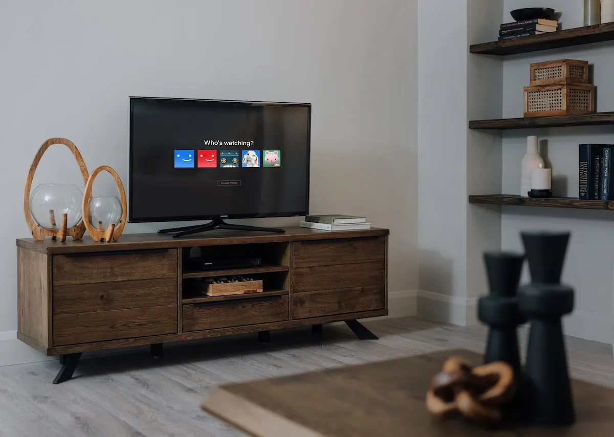 A lifestyle image of the Arno smoked TV unit with Kimora Candle holders