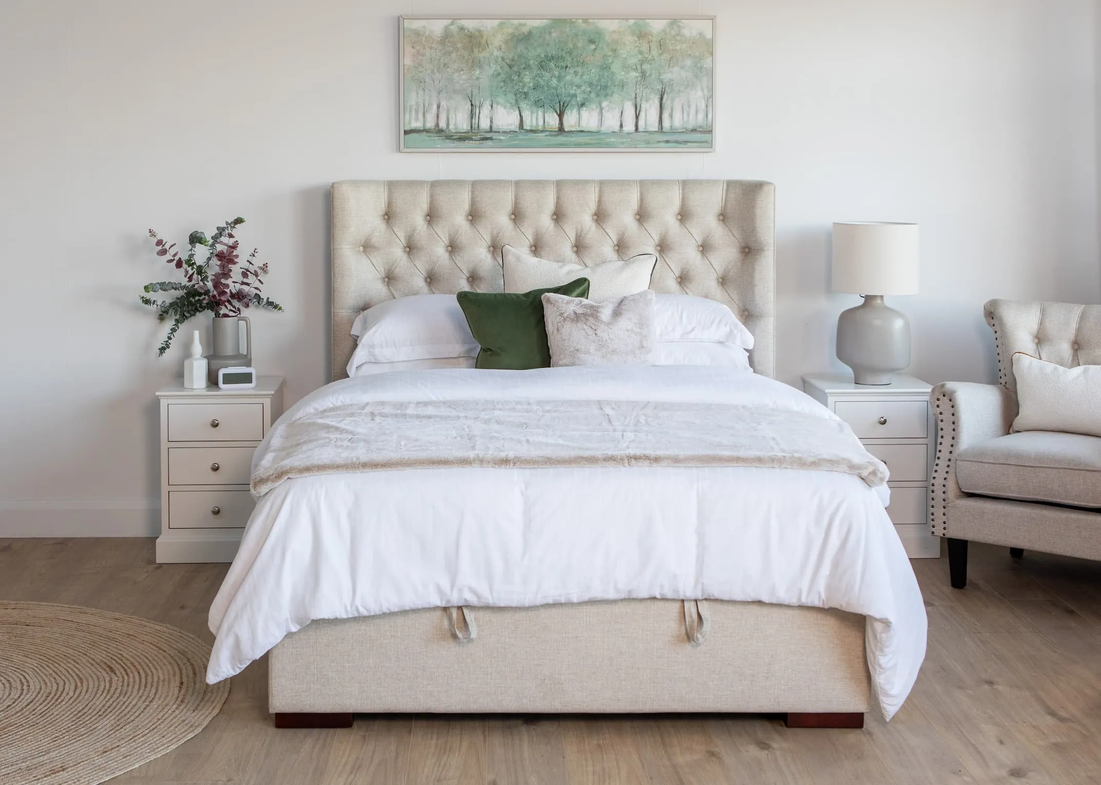 A lifestyle image of the Chester Ottoman with Daydream canvas and Sara Linen Chair.