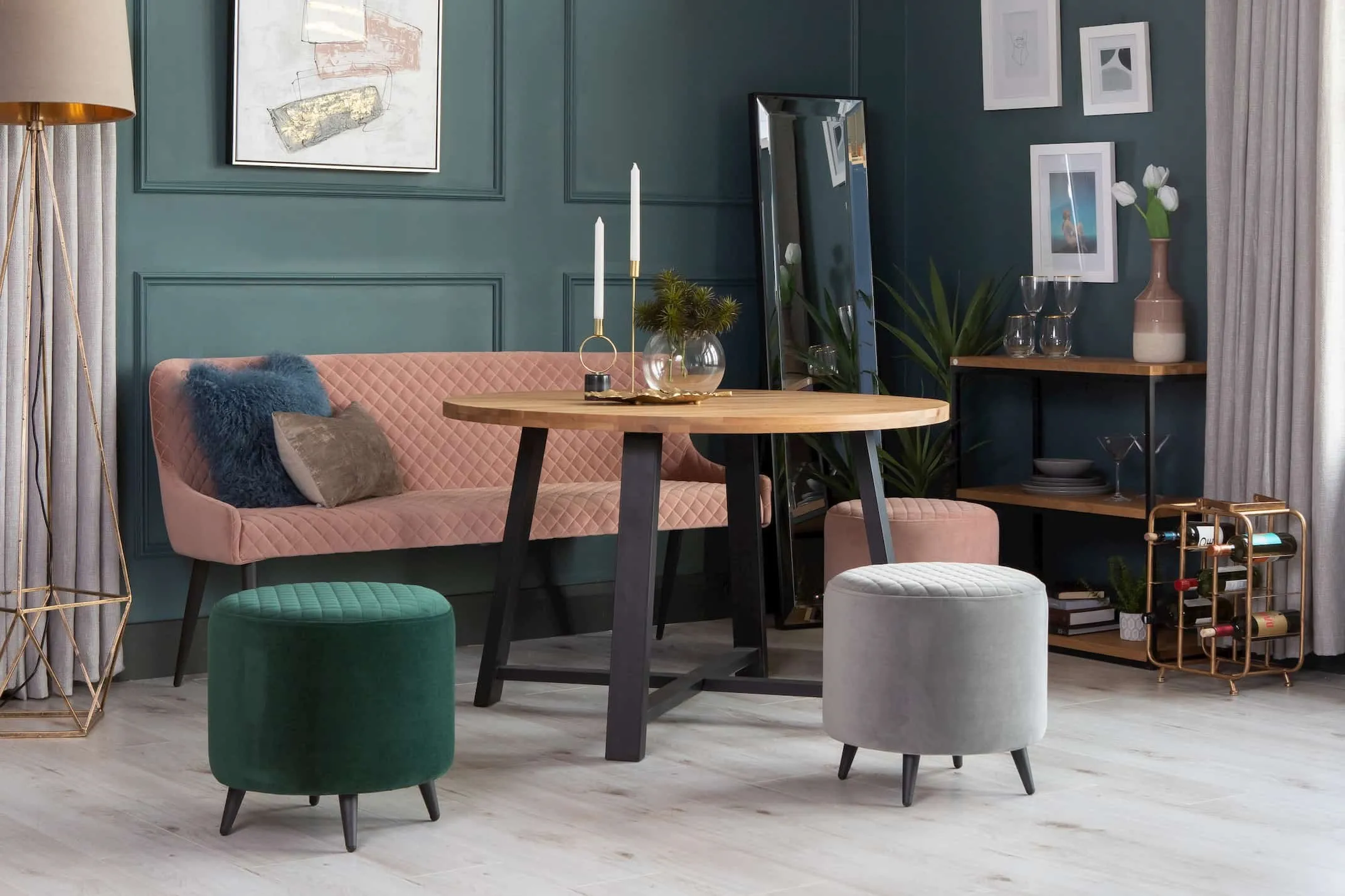 A lifestyle image of the Ottowa Velvet Foot stool with the Mila Round Table & other ottowa Footstools