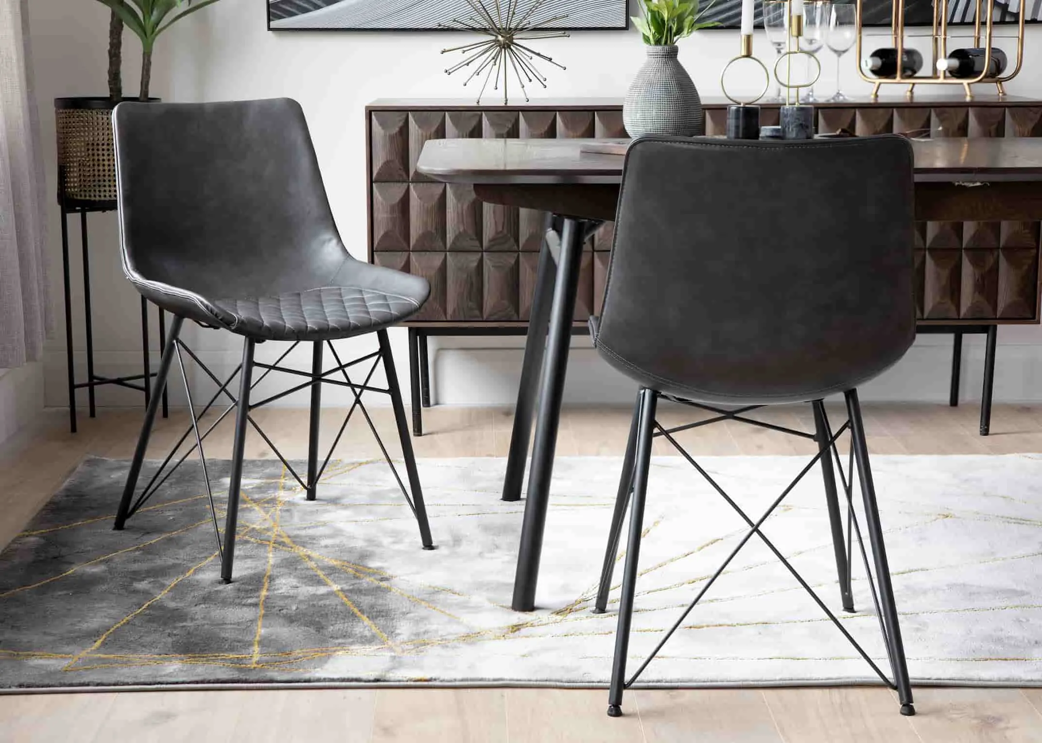 A lifestyle image of the Leo Grey Dining Chair with the Latina & Smoked Forest Dining Ranges