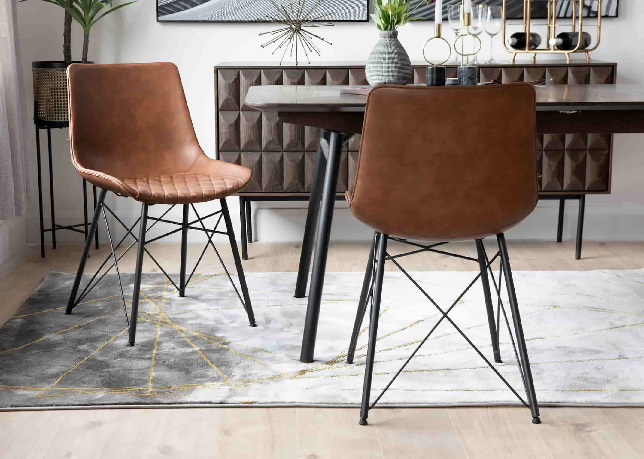 A lifestyle image of the Leo Brown Dining Chair with the Latina & Smoked Forest Dining Ranges