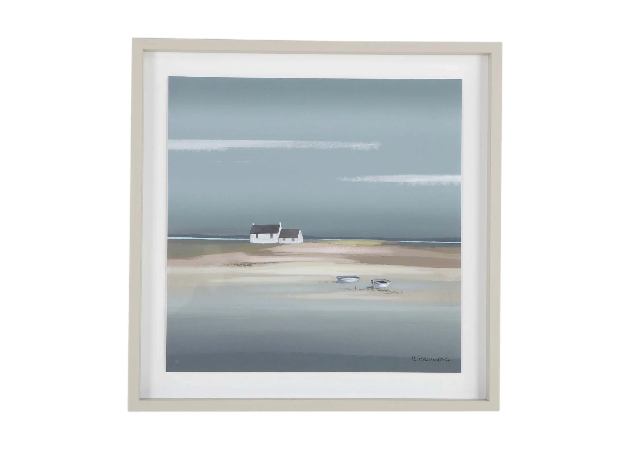 A beige framed print showing a coastal landscape from Ulyana Hammond. Front view.