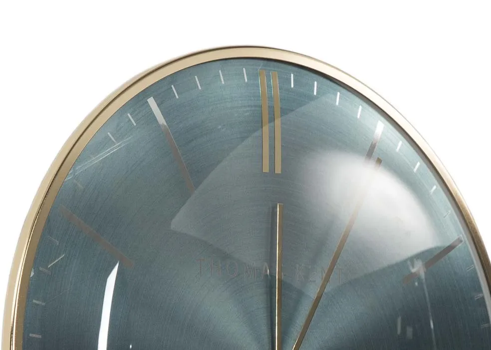 The large Teal oyster wall clock from the Thomas Kent collection at EZ Living Furniture close up top view.