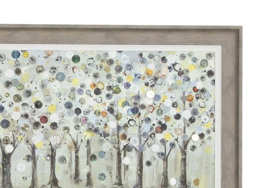 A framed print of woodland trees in earthy tones with a grey frame from Ulyana Hammond. Closeup view.