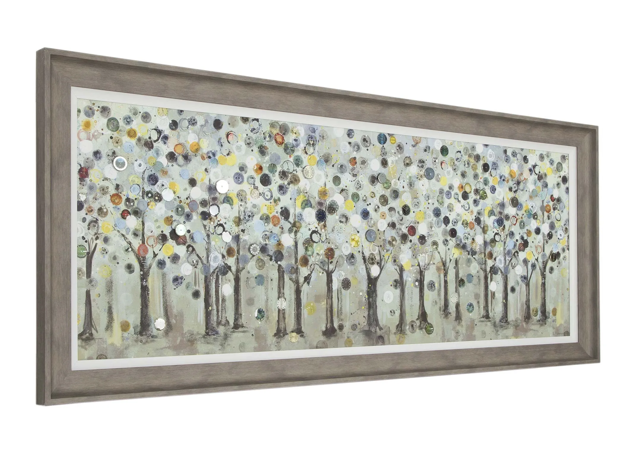 A framed print of woodland trees in earthy tones with a grey frame from Ulyana Hammond. Angle view.
