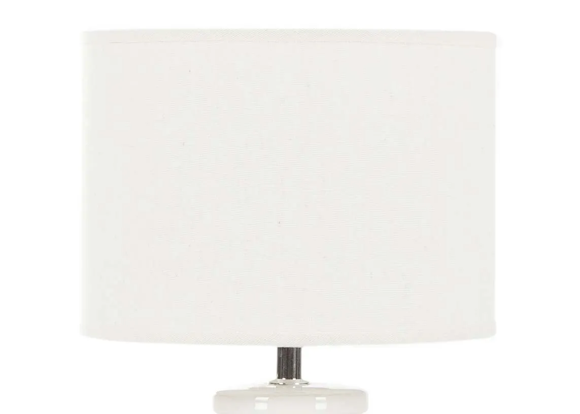 A light grey & white ceramic lamp base with white shade from EZ Living Furniture's Moy range. Closeup of barrel shade
