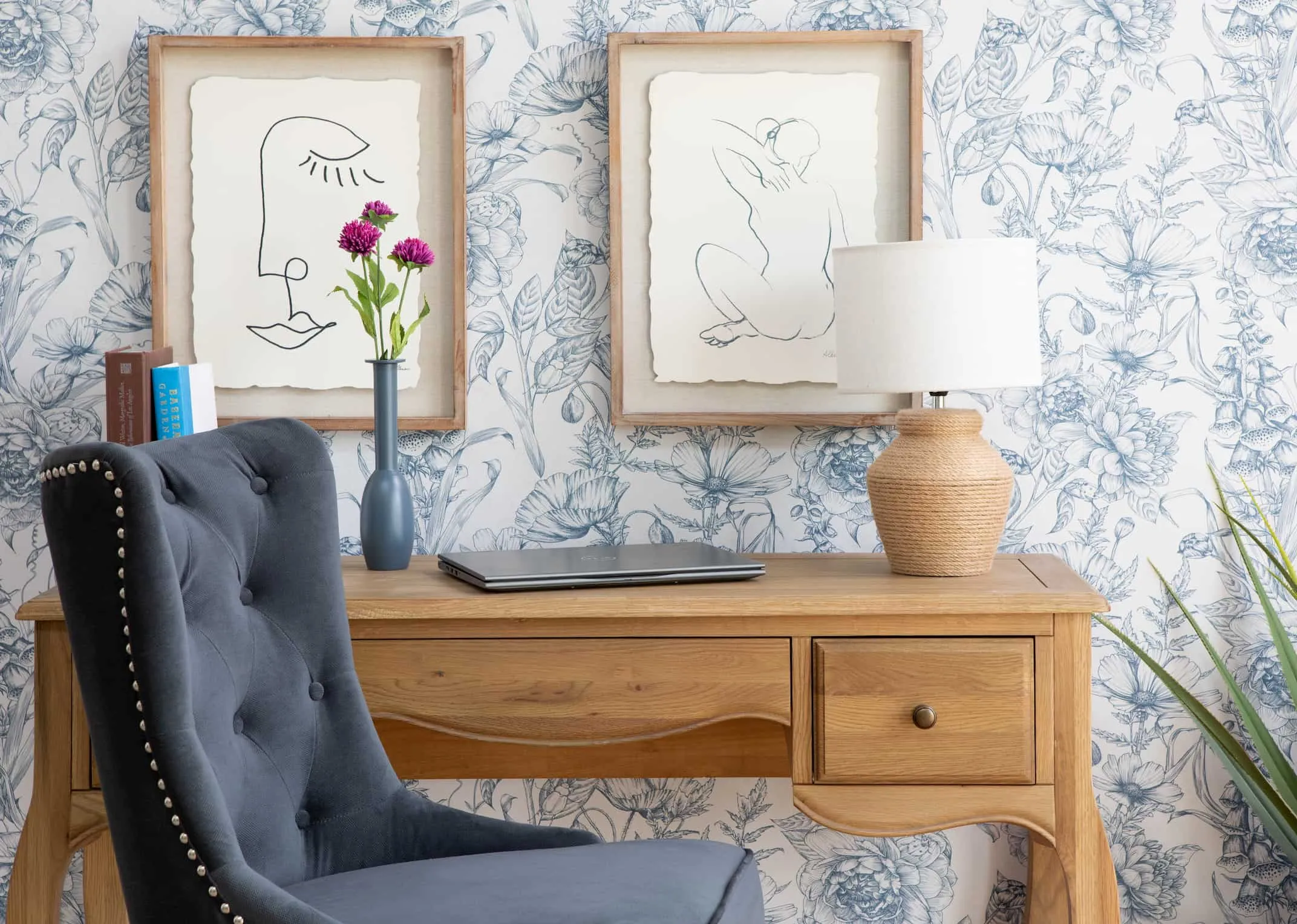 A lifestyle image of the Will Office Chair with Face & Nude Prints with the Slaney Lamp
